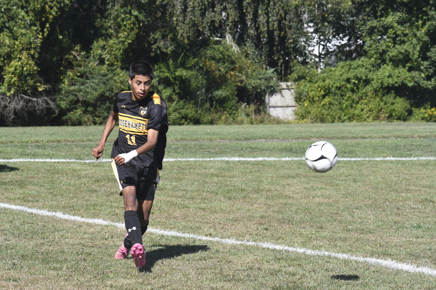 Bridgehampton sophomore Steven Lucero Morocho sends the ball upfield.  DREW BUDD