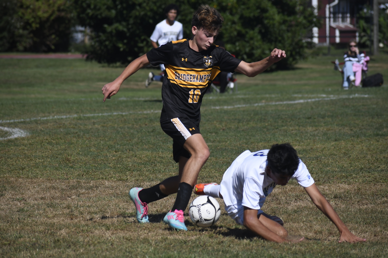 Bridgehampton freshman Nate Feierstein pressures a Mattituck player.  DREW BUDD
