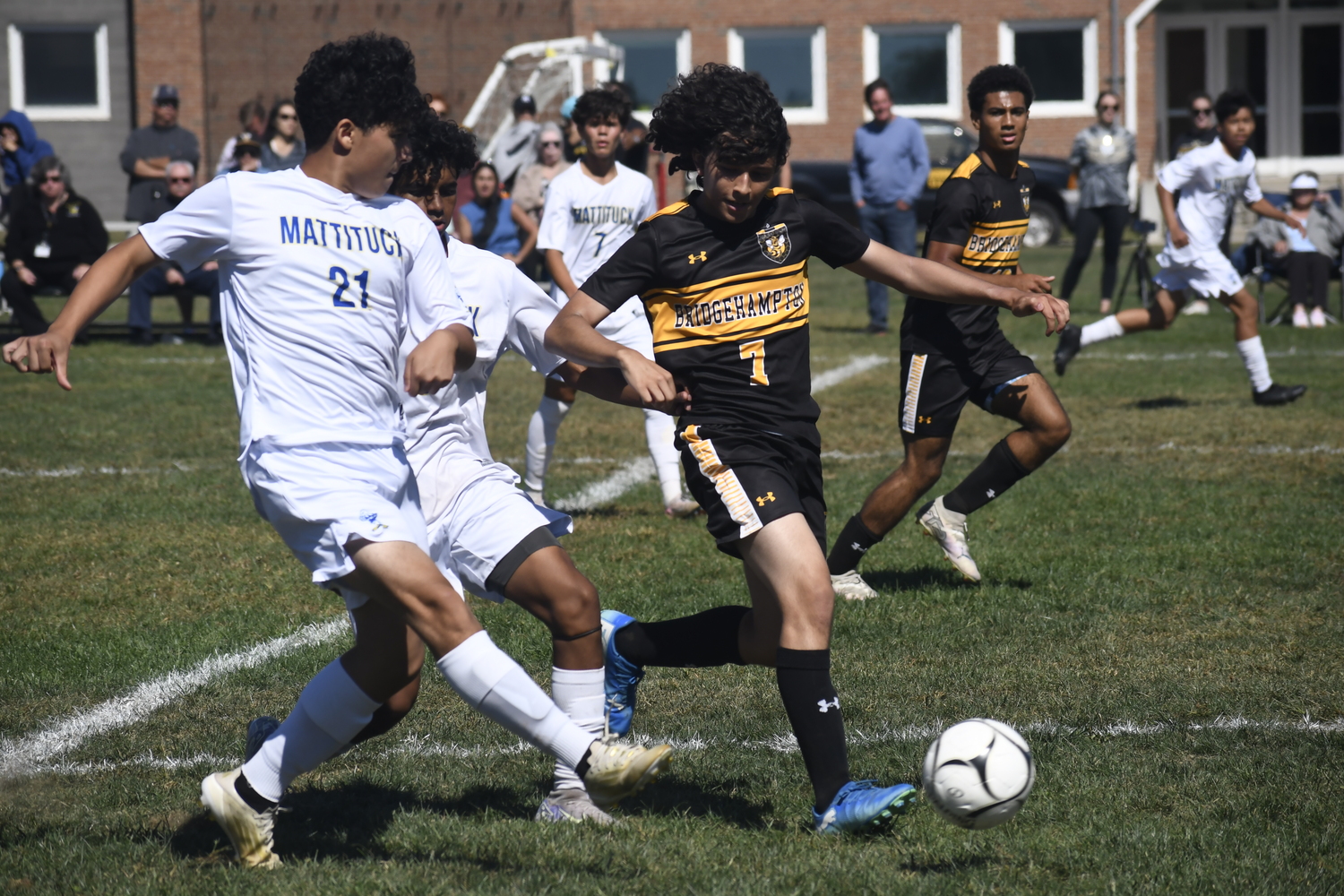 Bridgehampton junior Joseph Penafiel tries to cover a pair of Mattituck players.  DREW BUDD