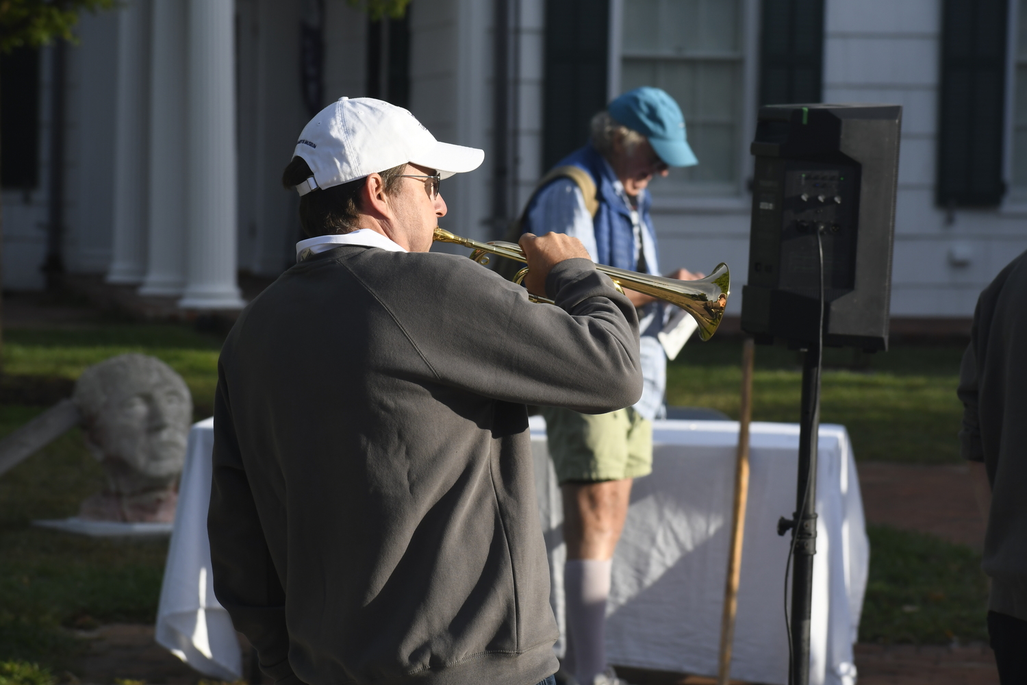 Bridgehampton Museum Vice President Harry Hackett III plays the bugle at the Potatohampton 5K on Sunday morning.  DREW BUDD