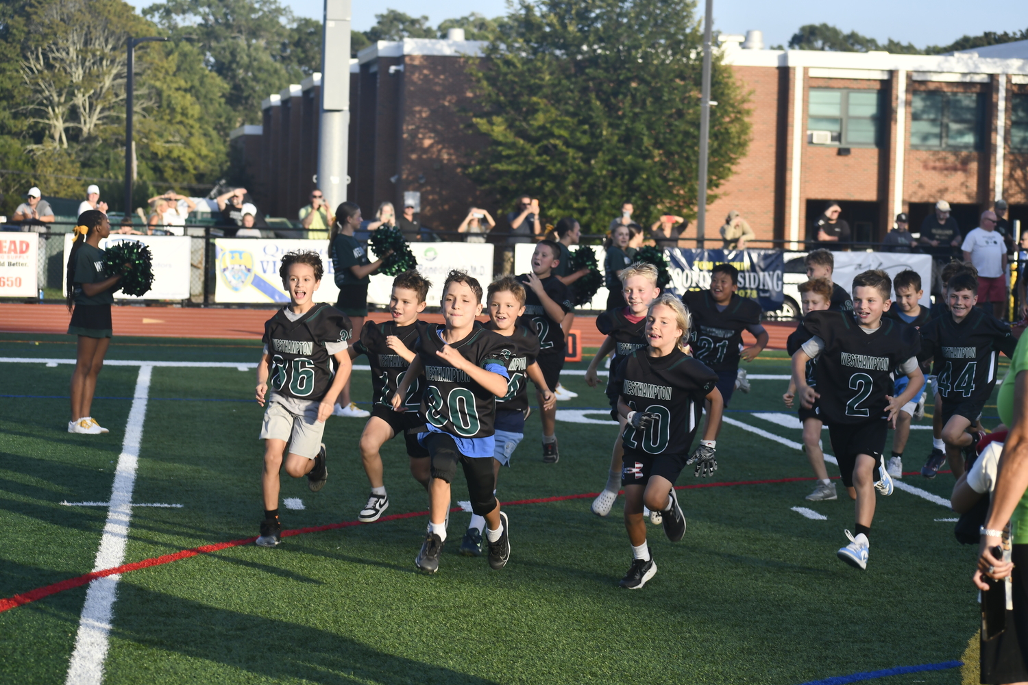 Youth football players were featured prior to the varsity game on Friday night.  DREW BUDD