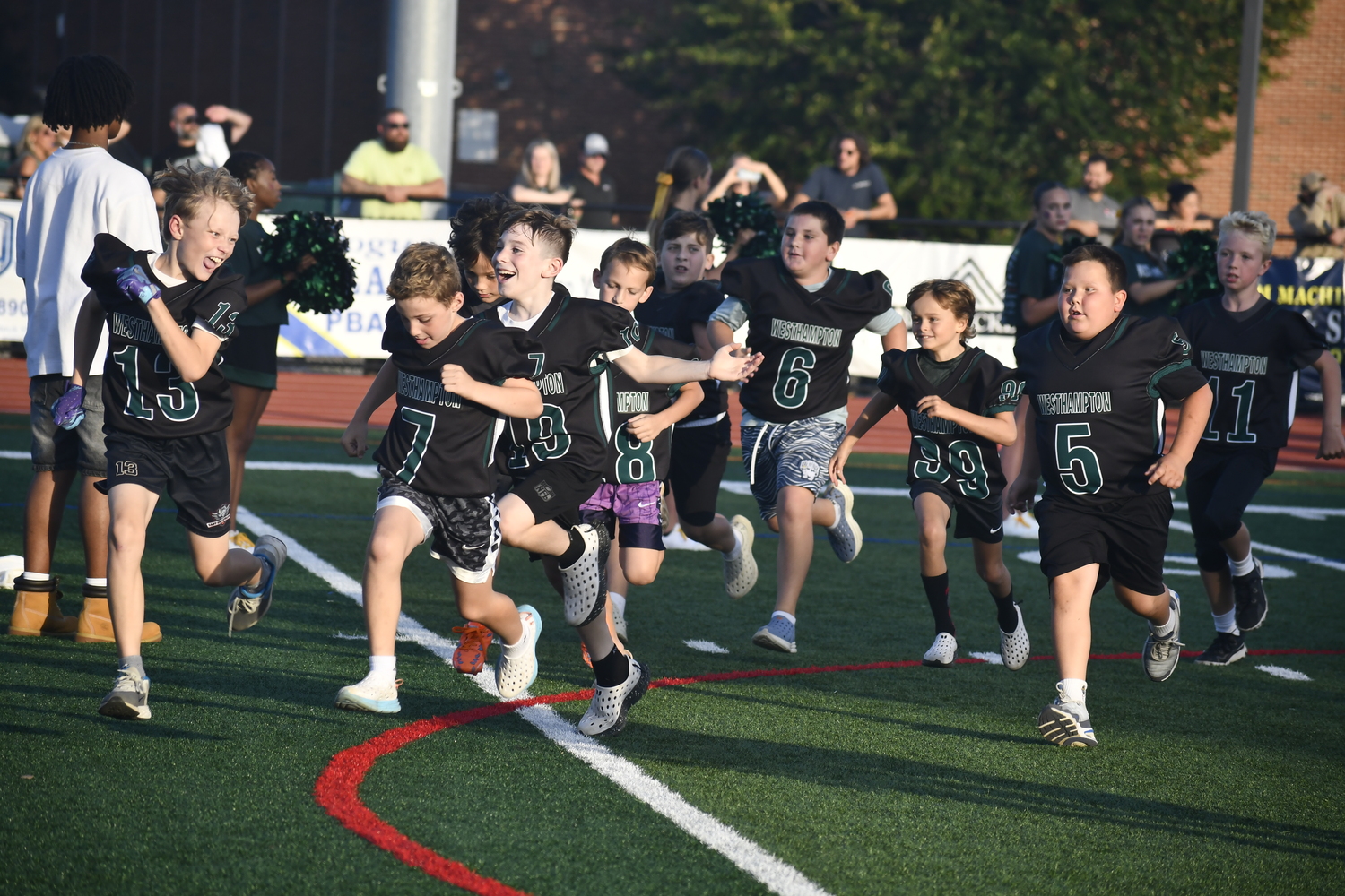 Youth football players were featured prior to the varsity game on Friday night.  DREW BUDD