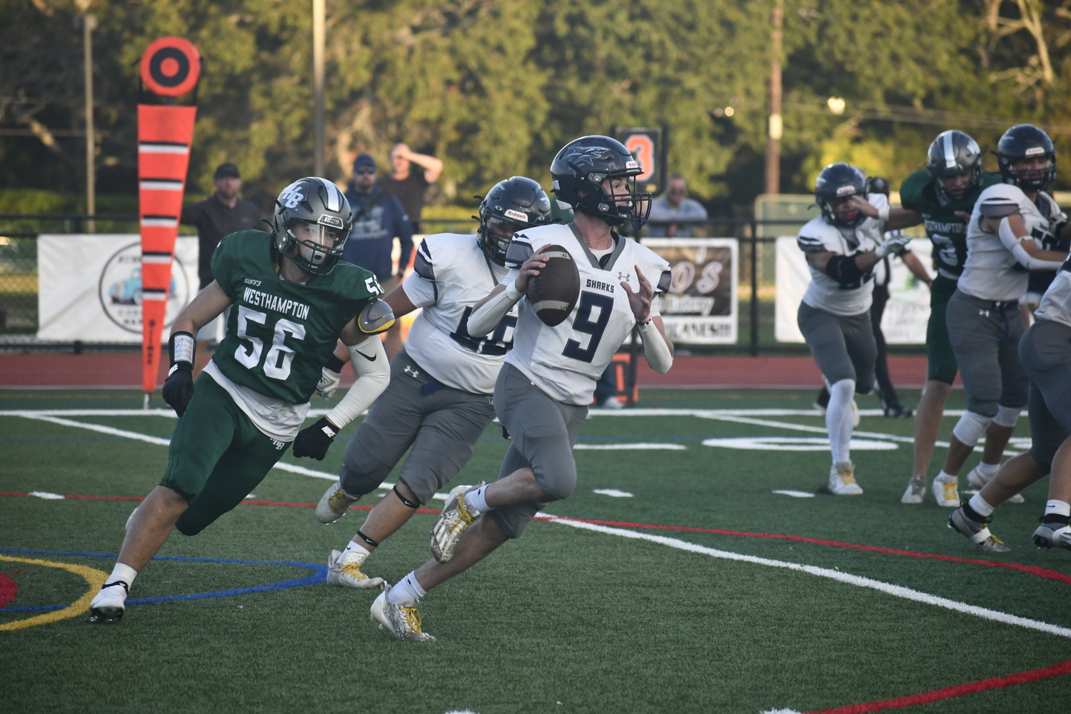 Westhampton Beach sophomore Sonny Hebberd has ESM quarterback Matthew Beardsley in his sights.  DREW BUDD