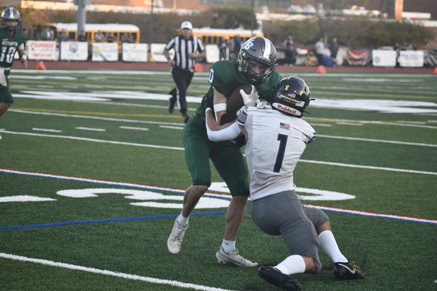 Nate LoGelfo is taken down by Cole Klein after catching a screen pass. Later in the game, LoGelfo caught a 76-yard touchdown pass from quarterback Pat Fay.  DREW BUDD
