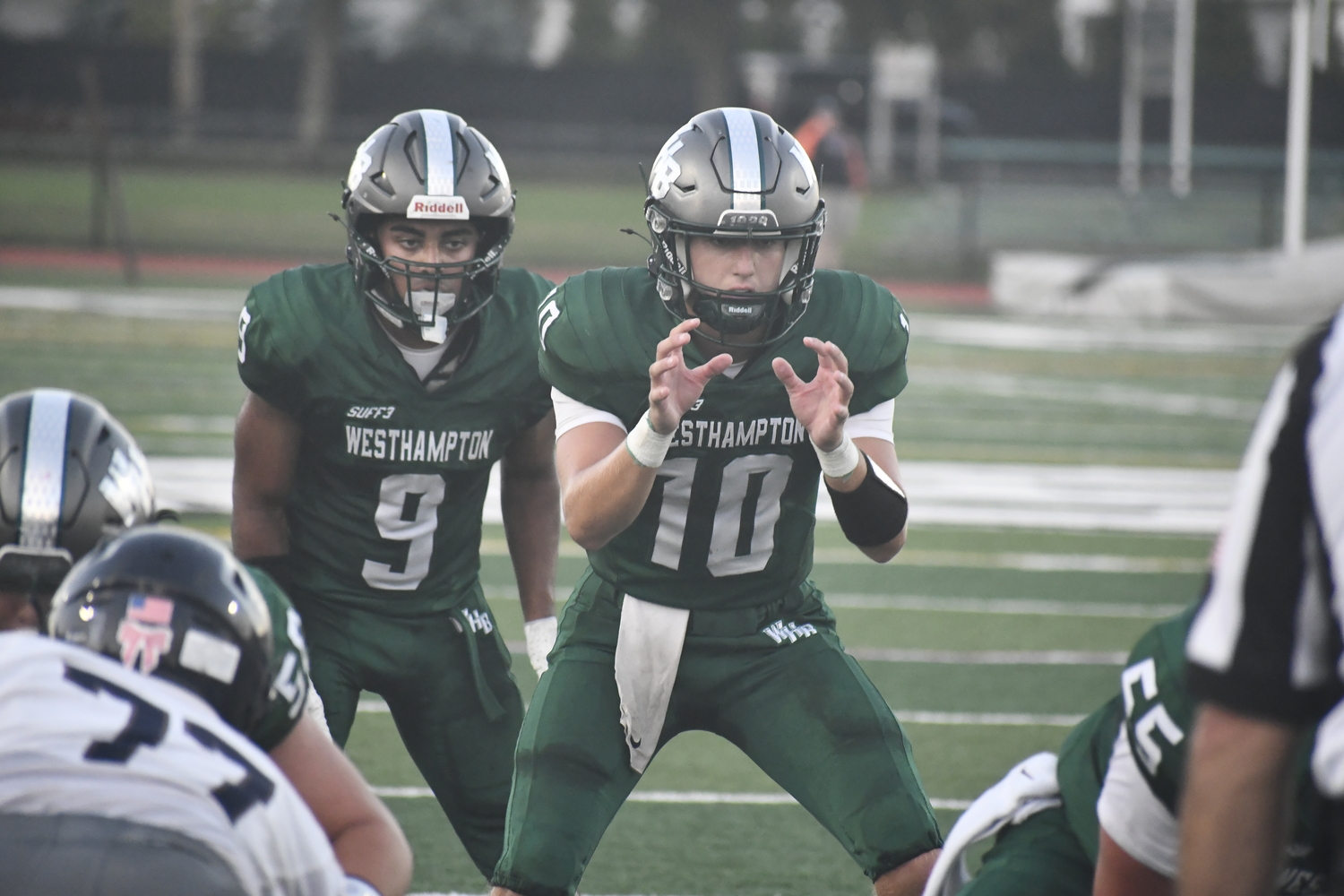 Westhampton Beach senior quarterback Pat Fay calls for the ball with junior running back Nic Simone set to get the ball behind him. DREW BUDD