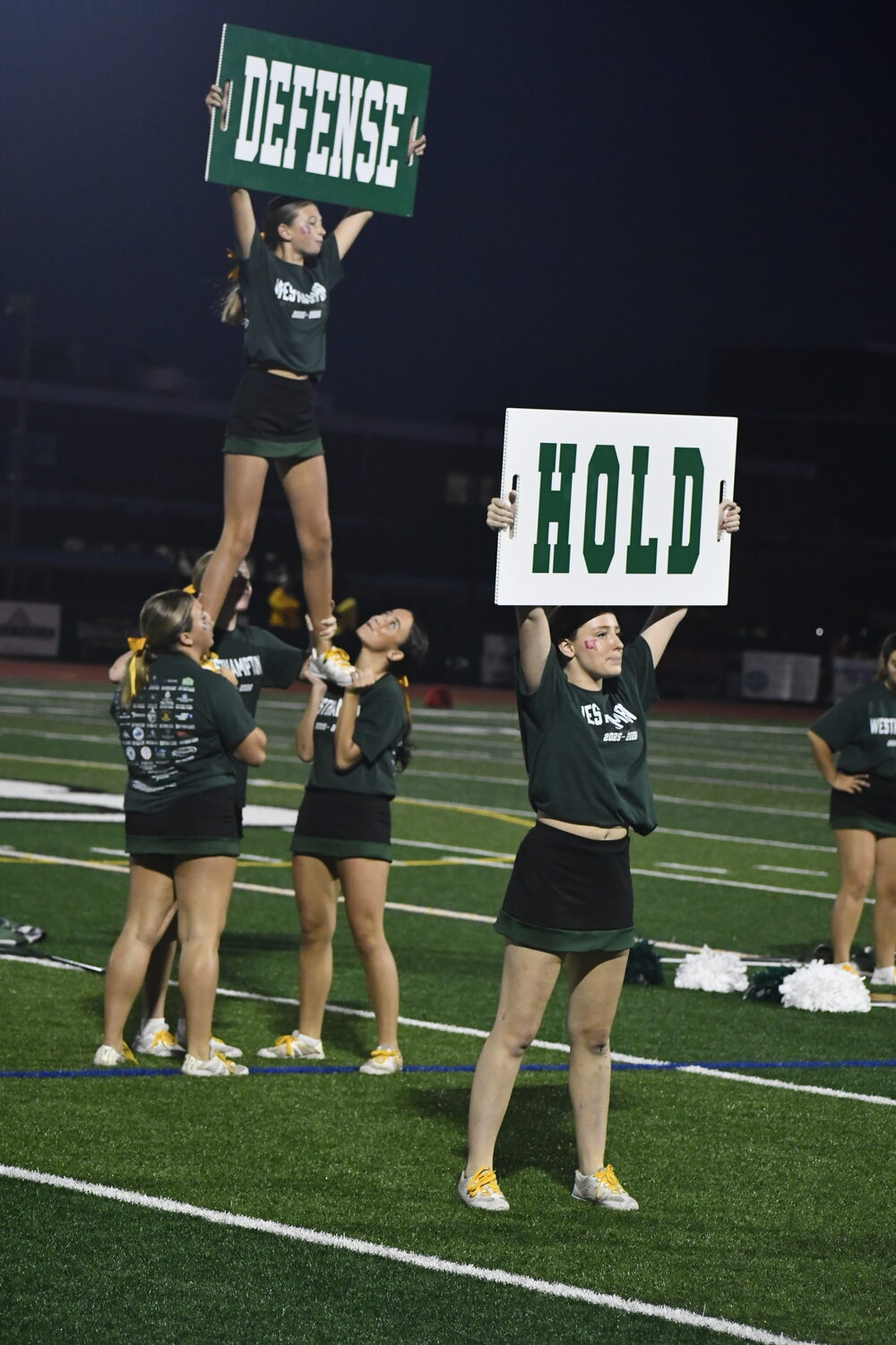 The Westhampton Beach varsity cheerleader perform a routine during halftime Friday night.  DREW BUDD
