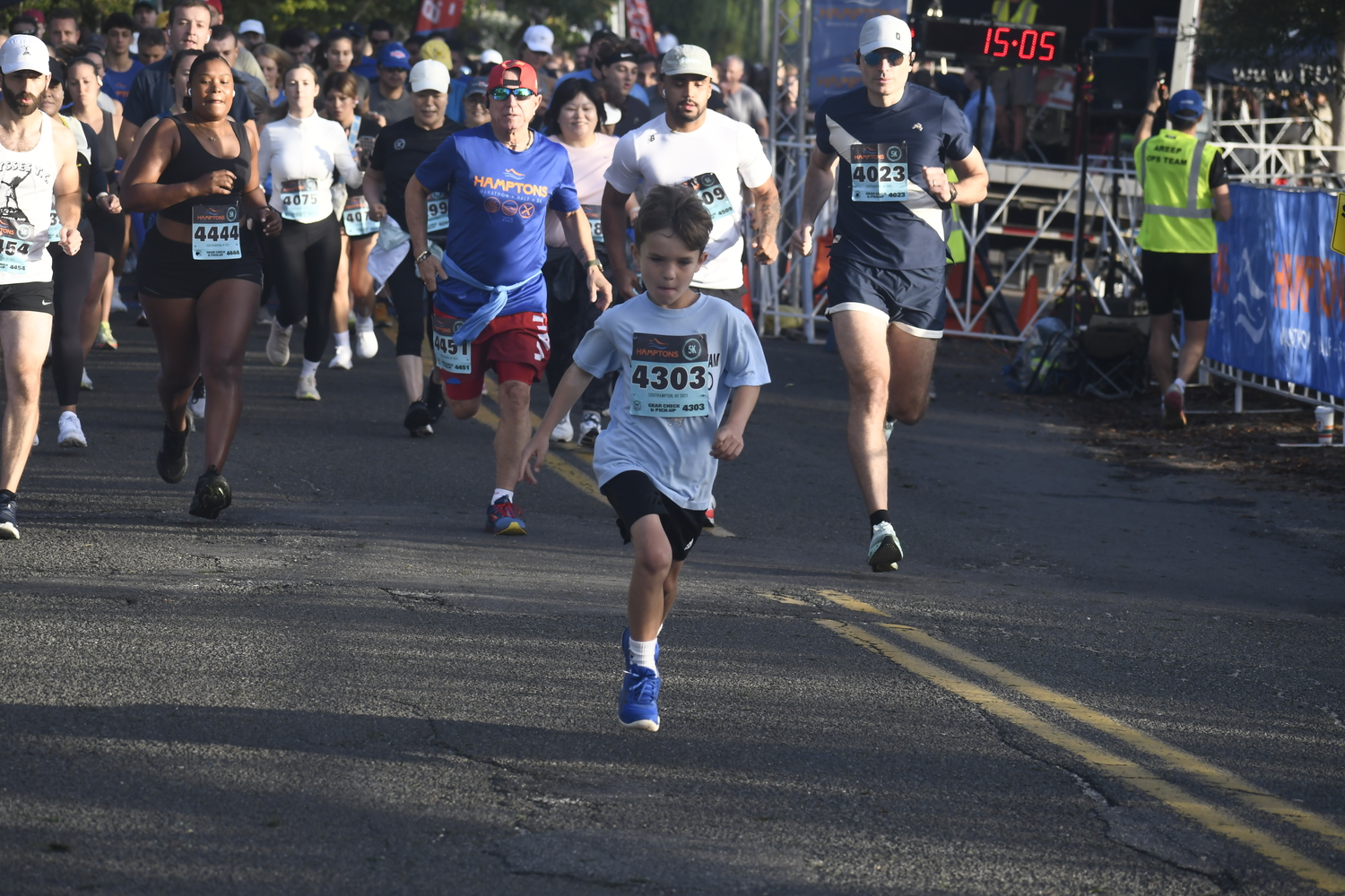 Preston Knoedler leads the group of runners out at the start of Saturday morning's 5K.  DREW BUDD