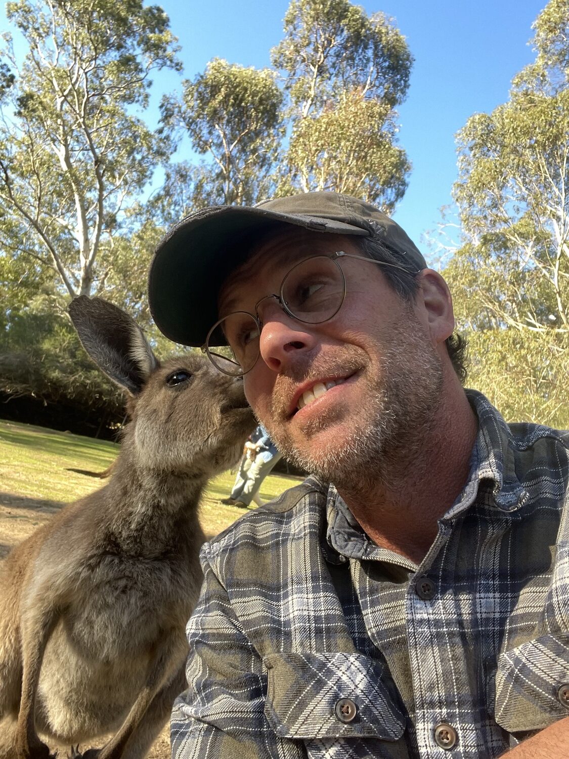 Christopher Pfeifle meets a kangaroo in his extensive travels installing Chihuly sculptures across the globe. COURTESY CHRISTOPHER PFEIFLE