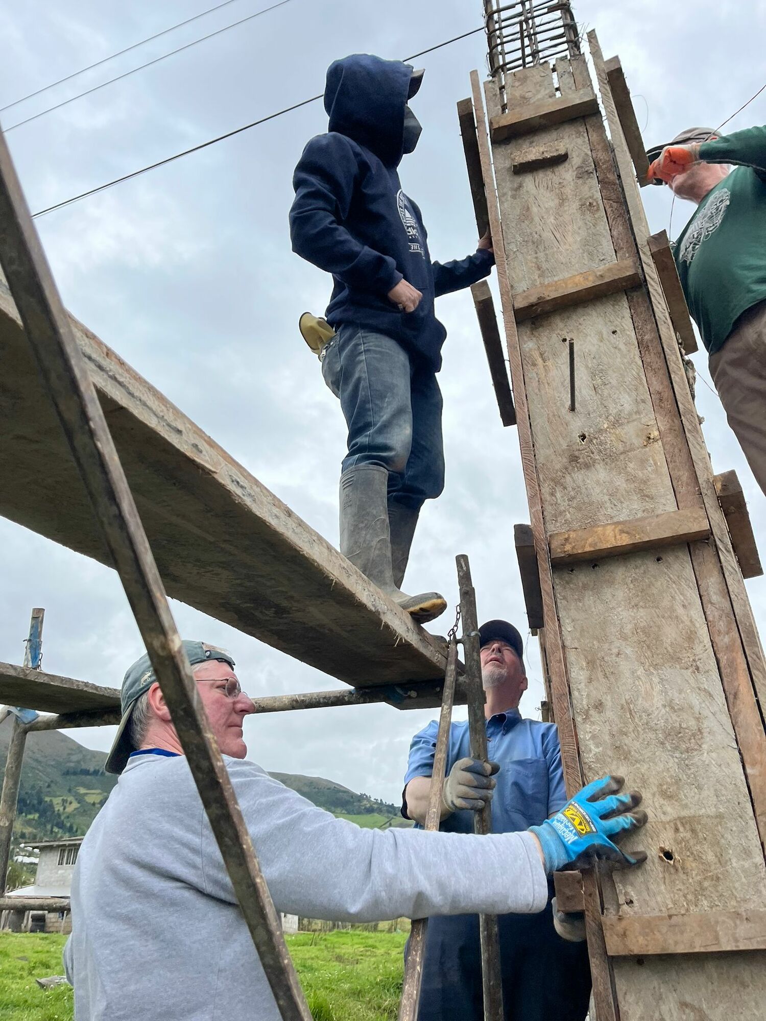 A group of volunteers help build a community center and church in Ecuador during a mission trip. COURTESY JUDI LACH VEECK
