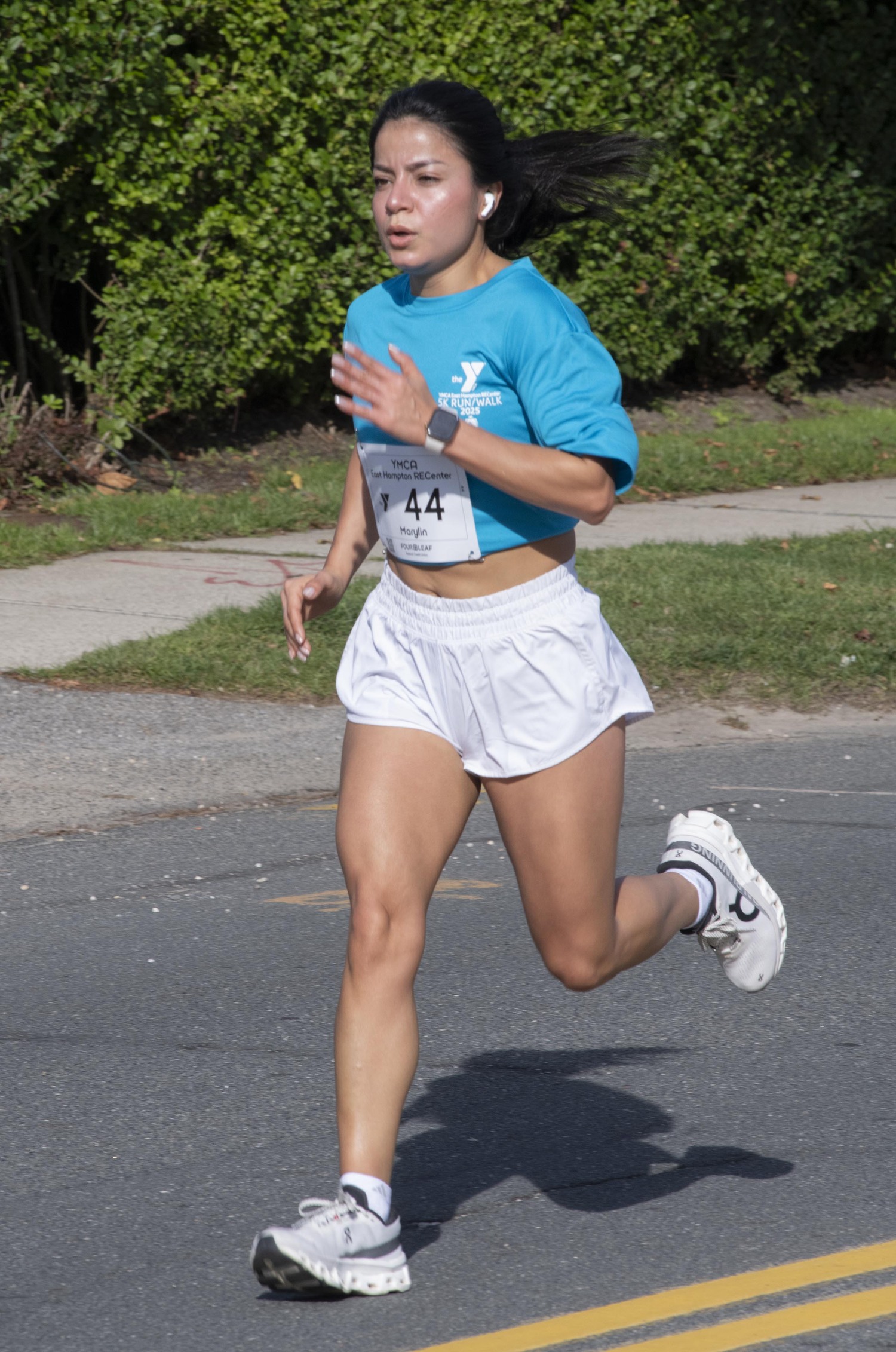 Marylin Gavilanez races toward the finish line. She finished second among women.  DOUG KUNTZ