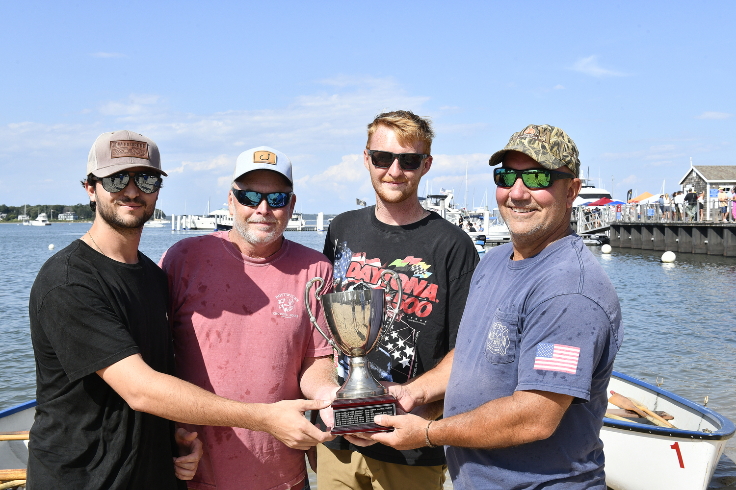 Sag Harbor Dive Team members Brice Linker, Scott Fordham, Kyle Fordham and Mike Guyer with the Firefighters Cup.  DANA SHAW