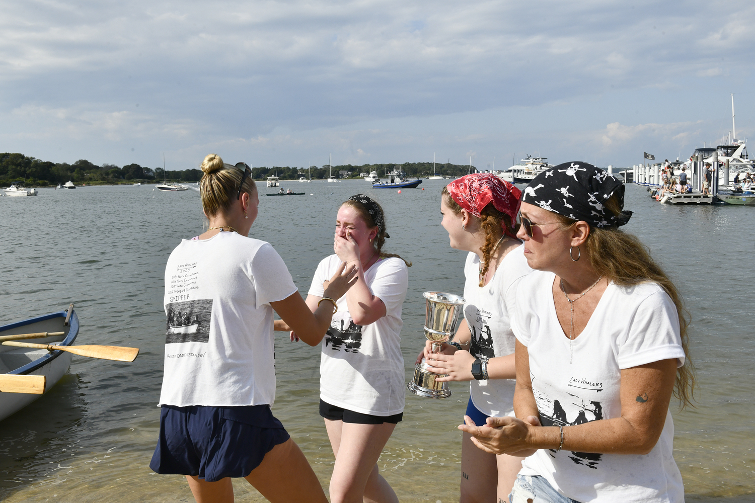Women's Whaleboat champions, Team Whalers: Lily Bradshaw, Maddie Martin, Kristen Pettigrew and Gina D'Orazio celebrate after their victory.  DANA SHAW