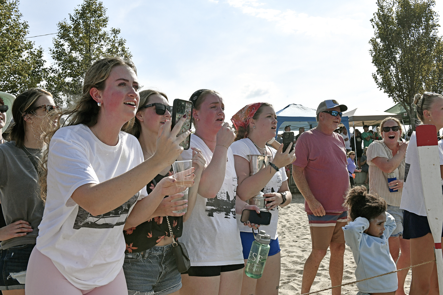 The Women's whalers team cheer for the men's team.  DANA SHAW