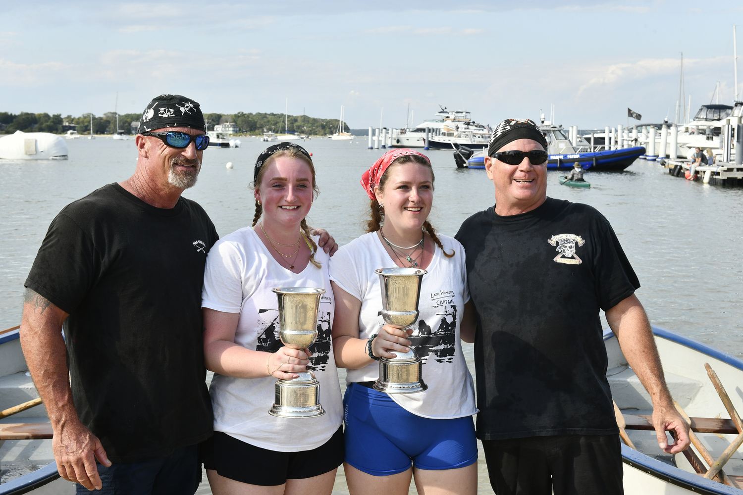 Fathers and daughters Bill and Maddie Martin and Kristen and Ray Pettigrew.  DANA SHAW