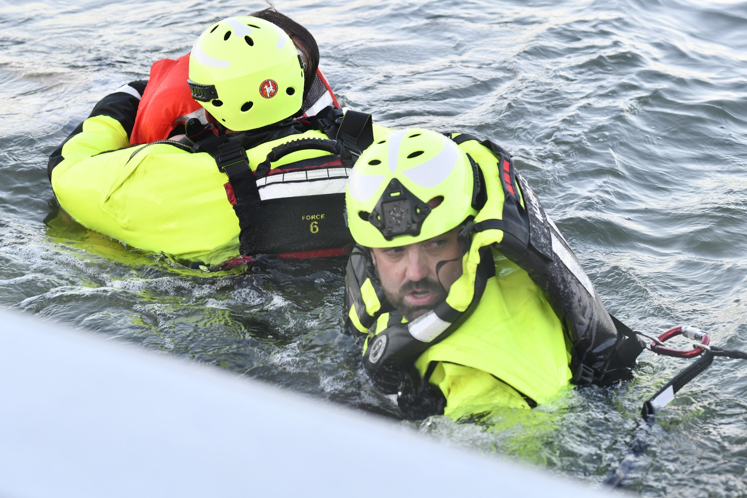 Southampton Fire Department Water Rescue Team members Alfred Callahan and Graham Fynes during a drill on September 23.  DANA SHAW