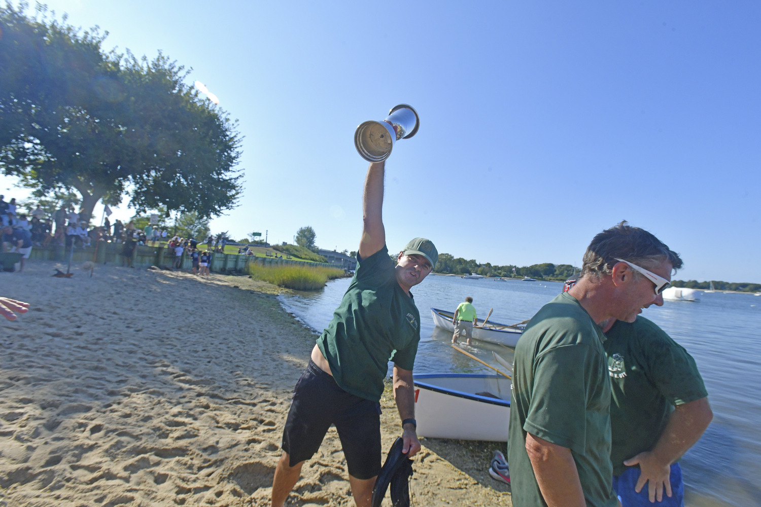 The John K. Ott men's whaleboat team celebrate their victory at HarborFest 2024.  DANA SHAW