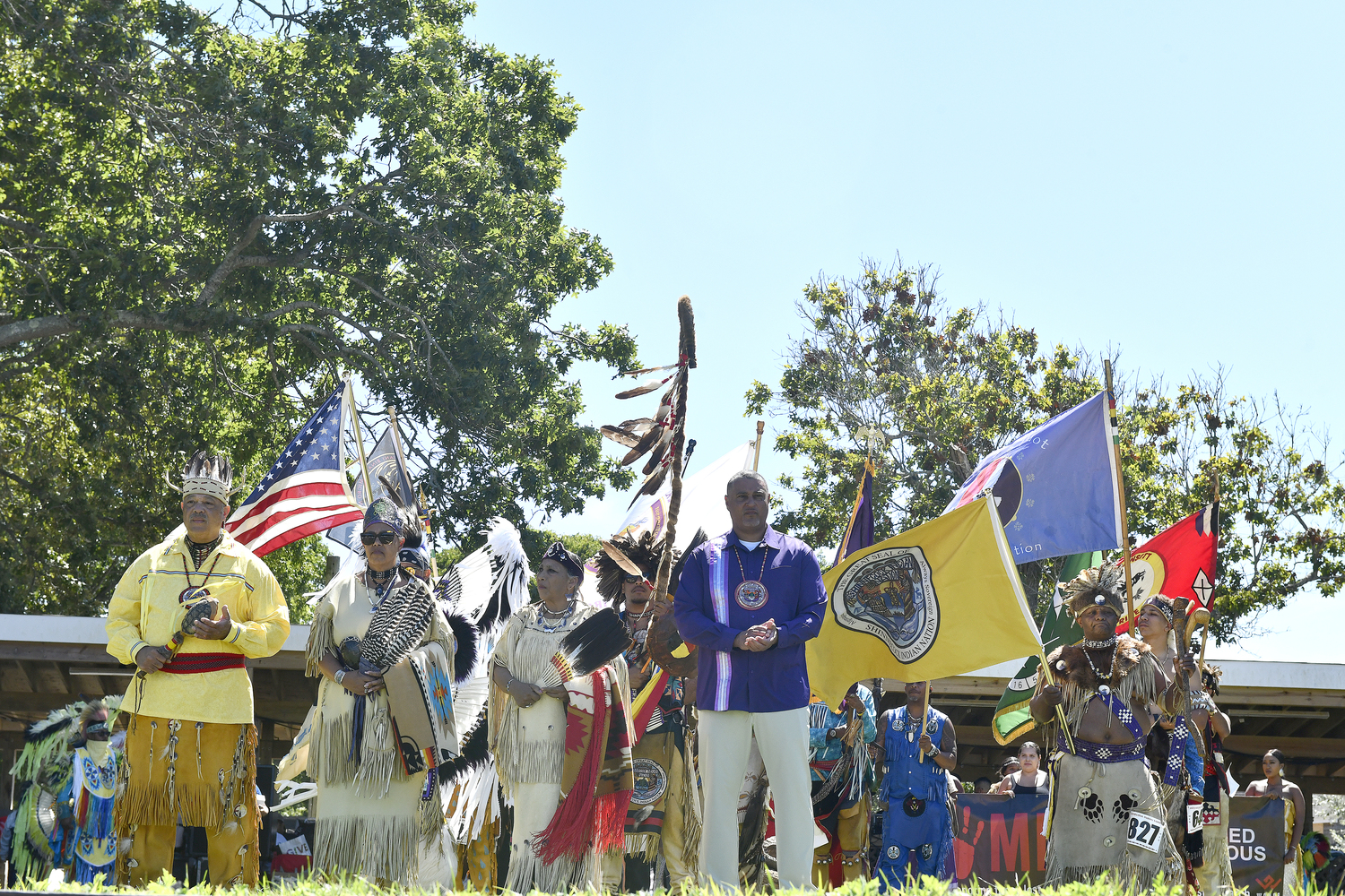 Sachem Daniel Collins Sr., Council of Trustees Chairwoman Lisa Goree, Sunksqua Linda Franklin and General Council Secretary Edgar Franklin III welcome the crowd to the 79th annual Shinnecock Powwow on Saturday.