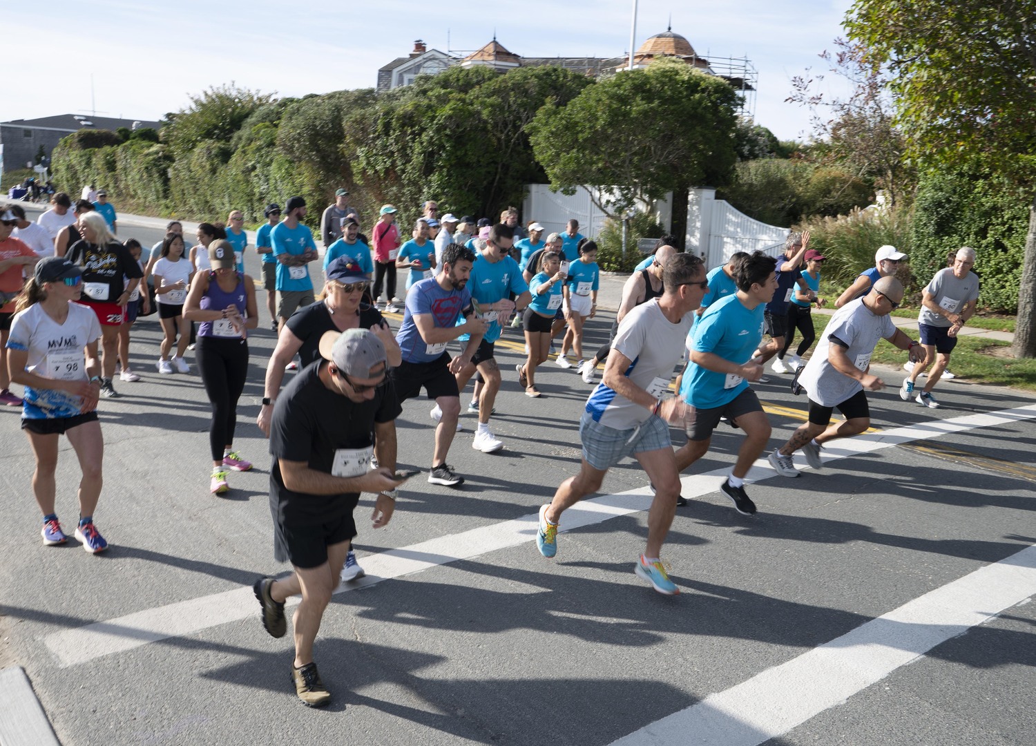 Runners and walkers start the YMCA East Hampton RECente 5K at Main Beach on Sunday morning.  DOUG KUNTZ