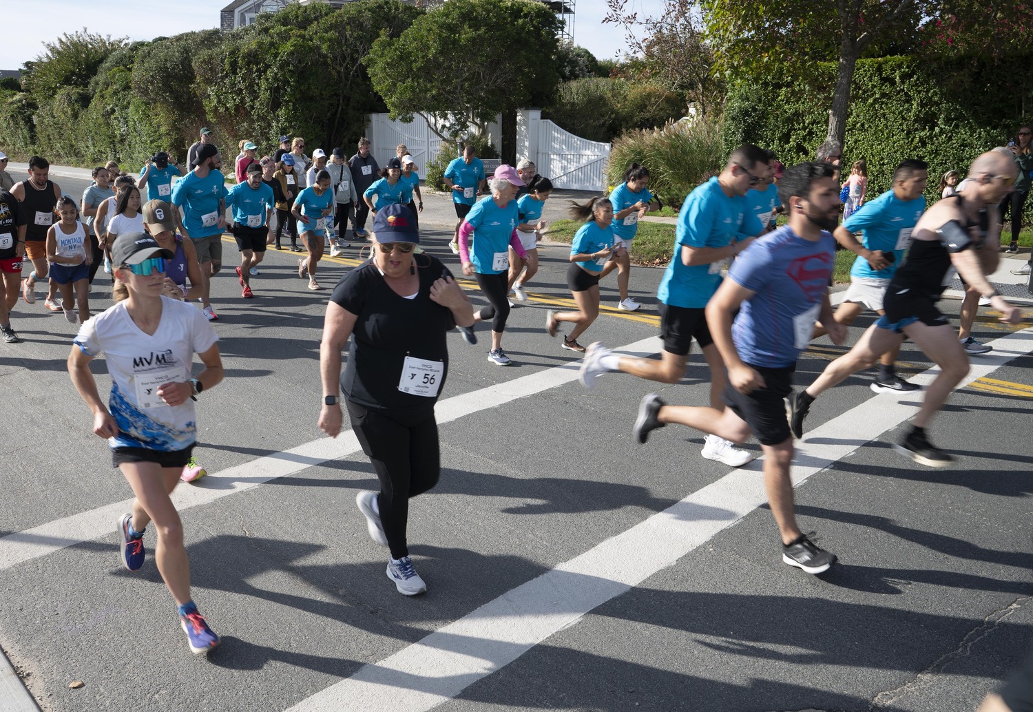 Runners and walkers start the YMCA East Hampton RECente 5K at Main Beach on Sunday morning.  DOUG KUNTZ