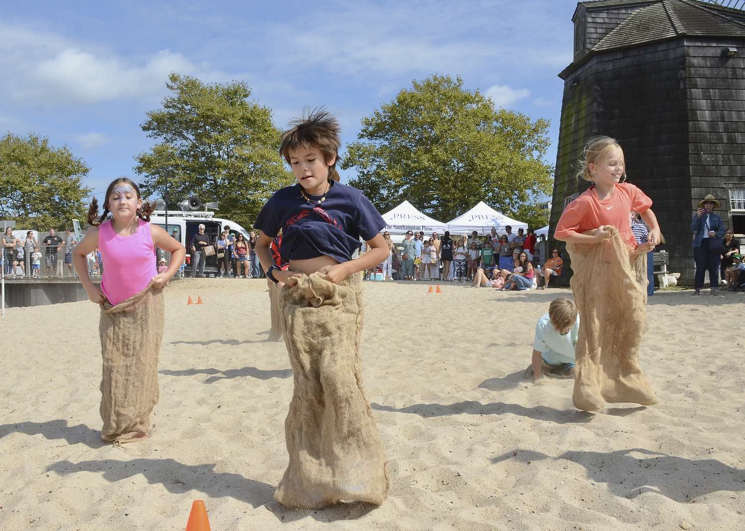 The potato sack race at windmill Beach on Saturday.  KYRIL BROMLEY