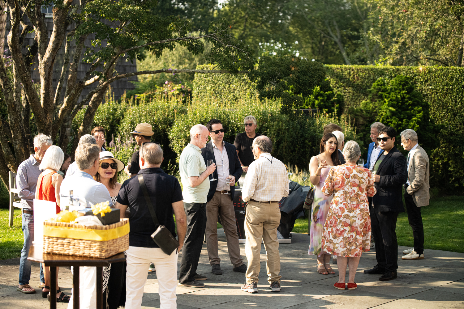 Patrons gathered autdoors at The Hamptons Festival of Music's “Tasting Notes” event, held August 16 at Hoie Hall. DANE DUPUIS