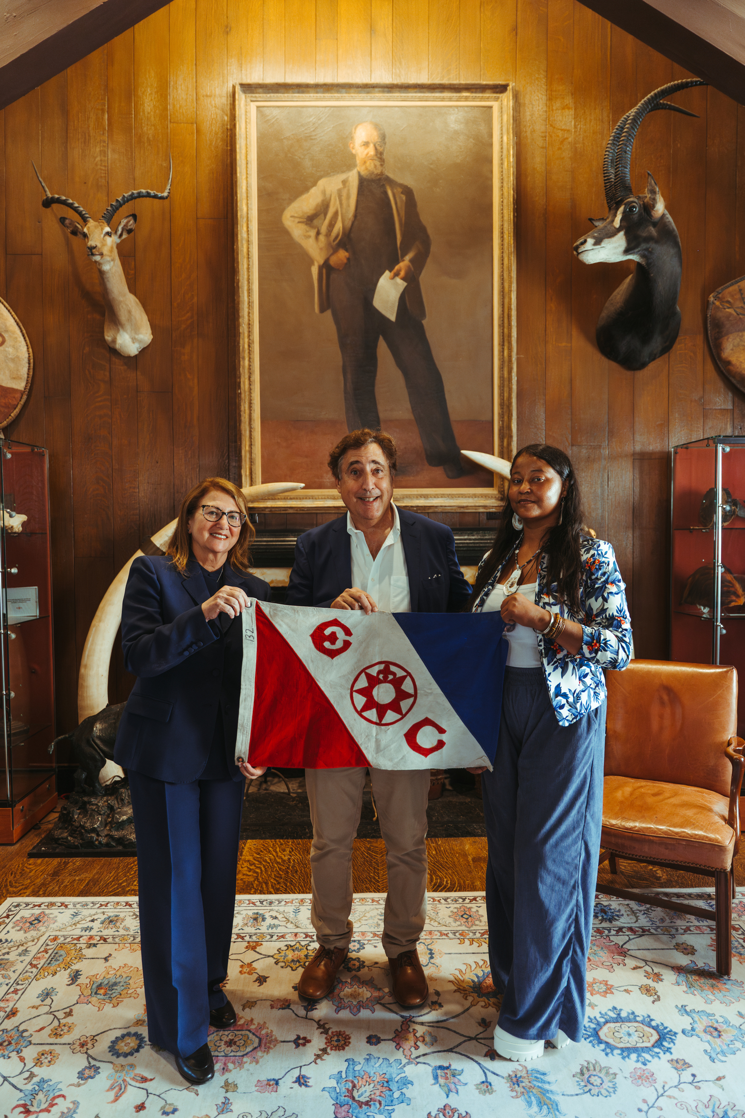 From left, Ellen Pikitch, Martin Nweeia, Vice President of Flags and Honors for the Explorers Club), and Sunshine Gumbs, at the official return of the flag to the club after the completion of the USV expedition in Shinnecock Bay. THE EXPLORERS CLUB/KONTENTIMENT