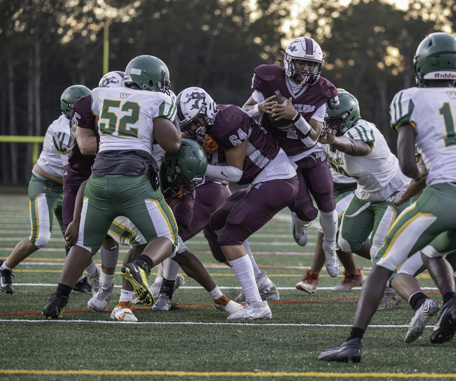 Alex Davis squeezes in behind a block from Tiger Brew for another score.  MARIANNE BARNETT