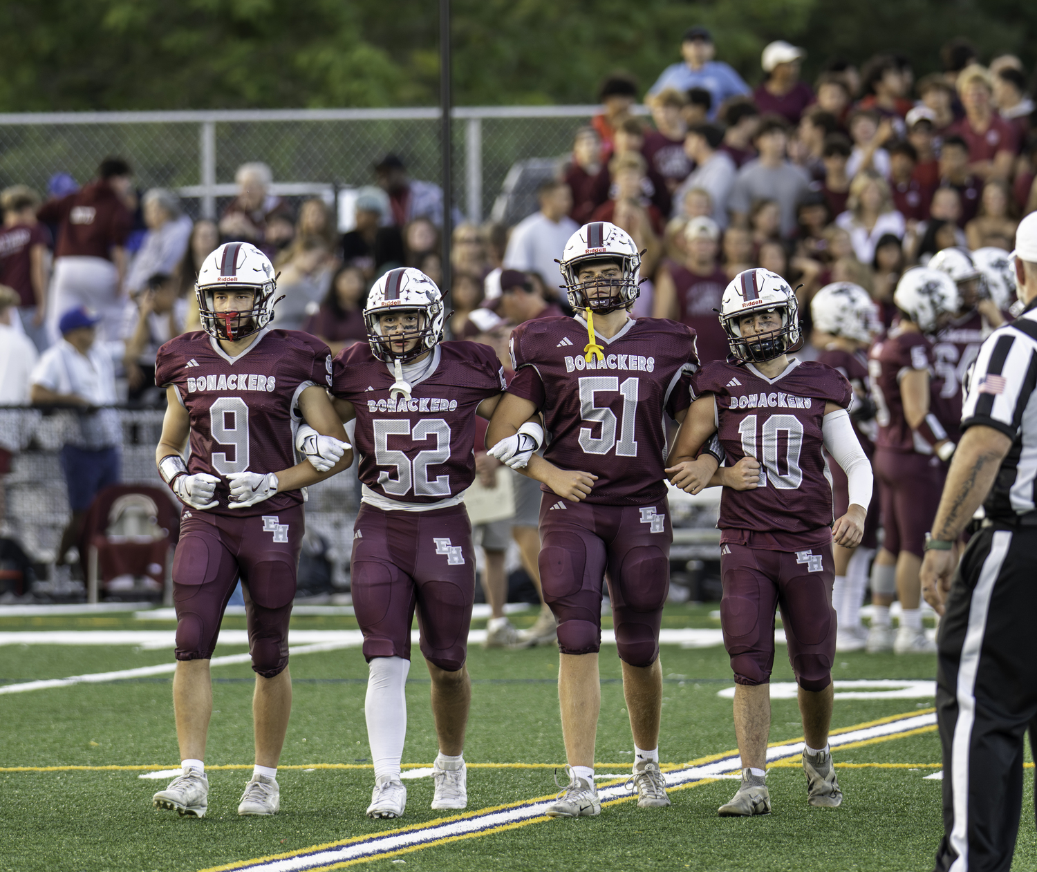 Bonac senior captains, from left, Charlie Stern, Jake Rivera, James Corwin and Theo Ball, head out to midfield for the coin toss.  MARIANNE BARNETT