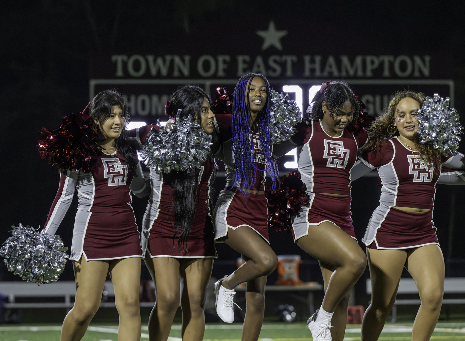 East Hampton's varsity cheerleaders perform at halftime.  MARIANNE BARNETT