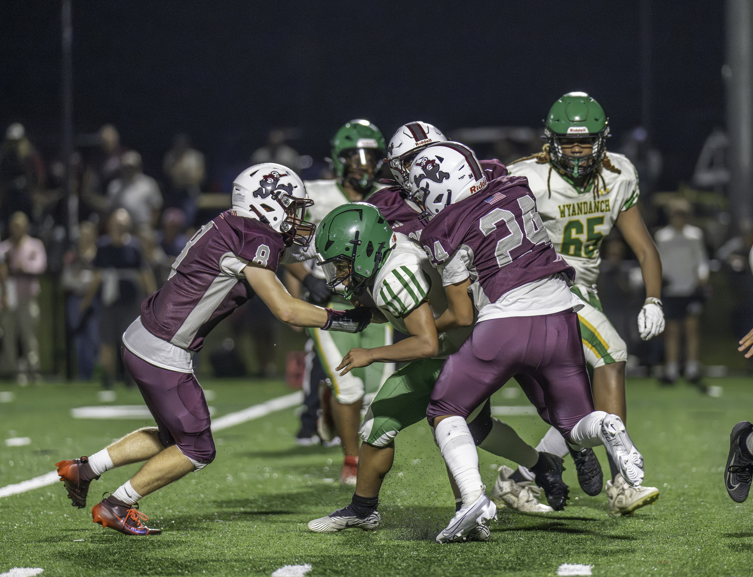 Owen Rodgers (8), Aiden Gavilanes and another Bonacker team up on a sack.  MARIANNE BARNETT