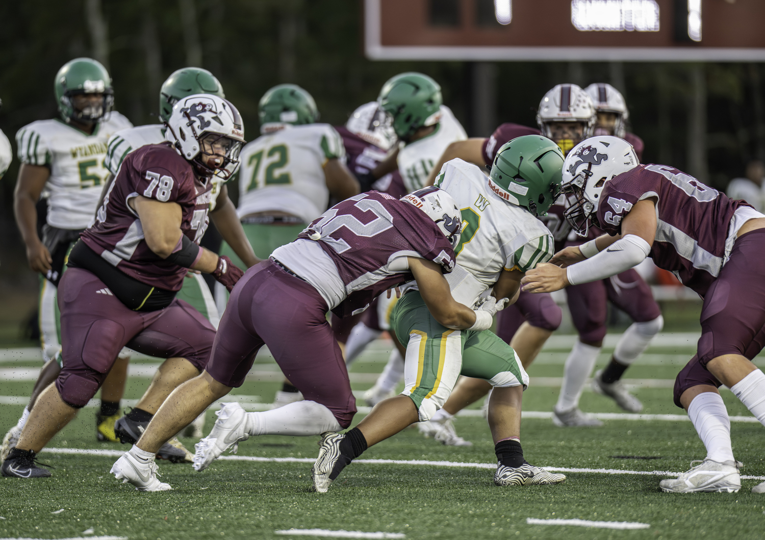East Hampton senior Jake Rivera tackles a Wyandanch ball carrier from behind.  MARIANNE BARNETT