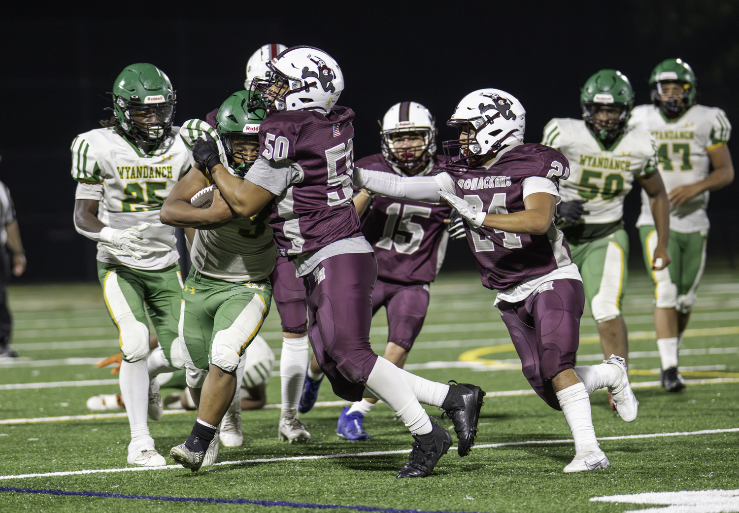 East Hampton senior Juan Espinoza tackles a Wyandanch player.  MARIANNE BARNETT