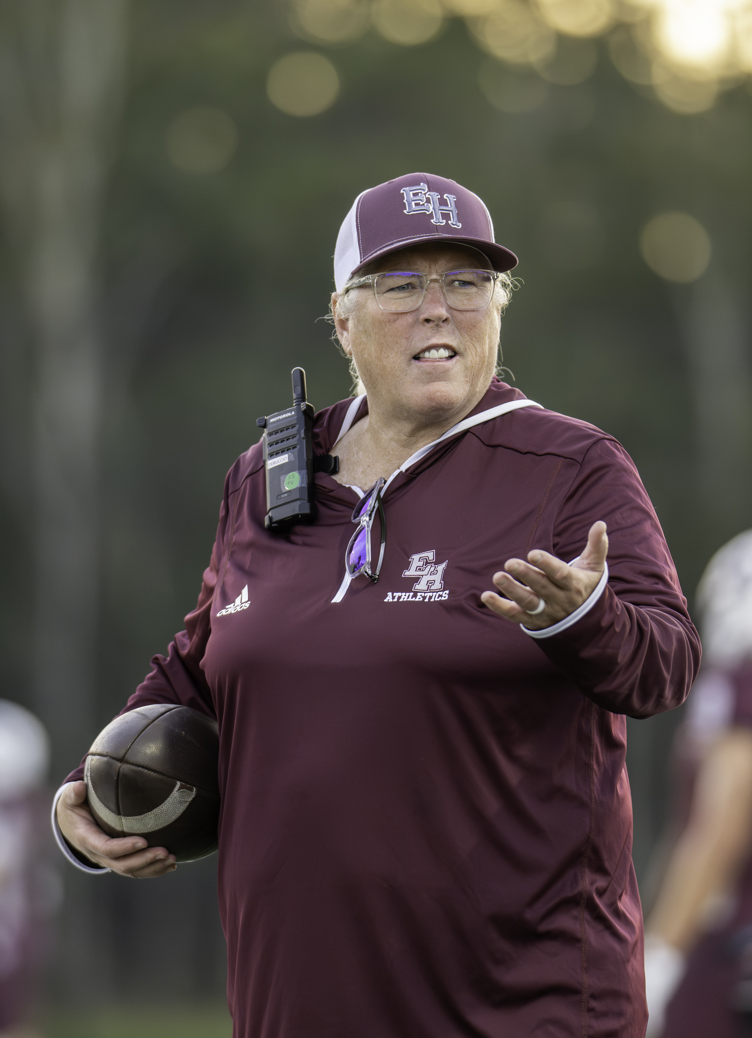 East Hampton Athletic Director Kathy Masterson with a game ball. MARIANNE BARNETT