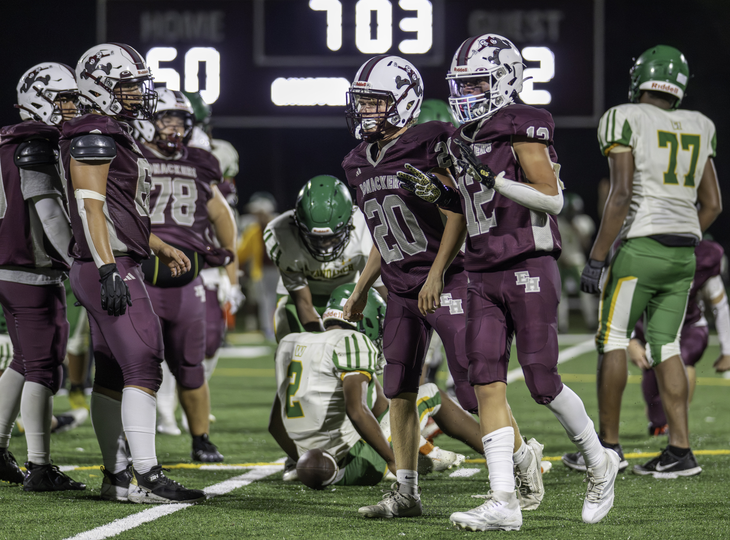 East Hampton junior Pax Minardi (12) got in on the action in the second half on Friday night with a tackle much to the appreciation of his teammates and coaches.  MARIANNE BARNETT