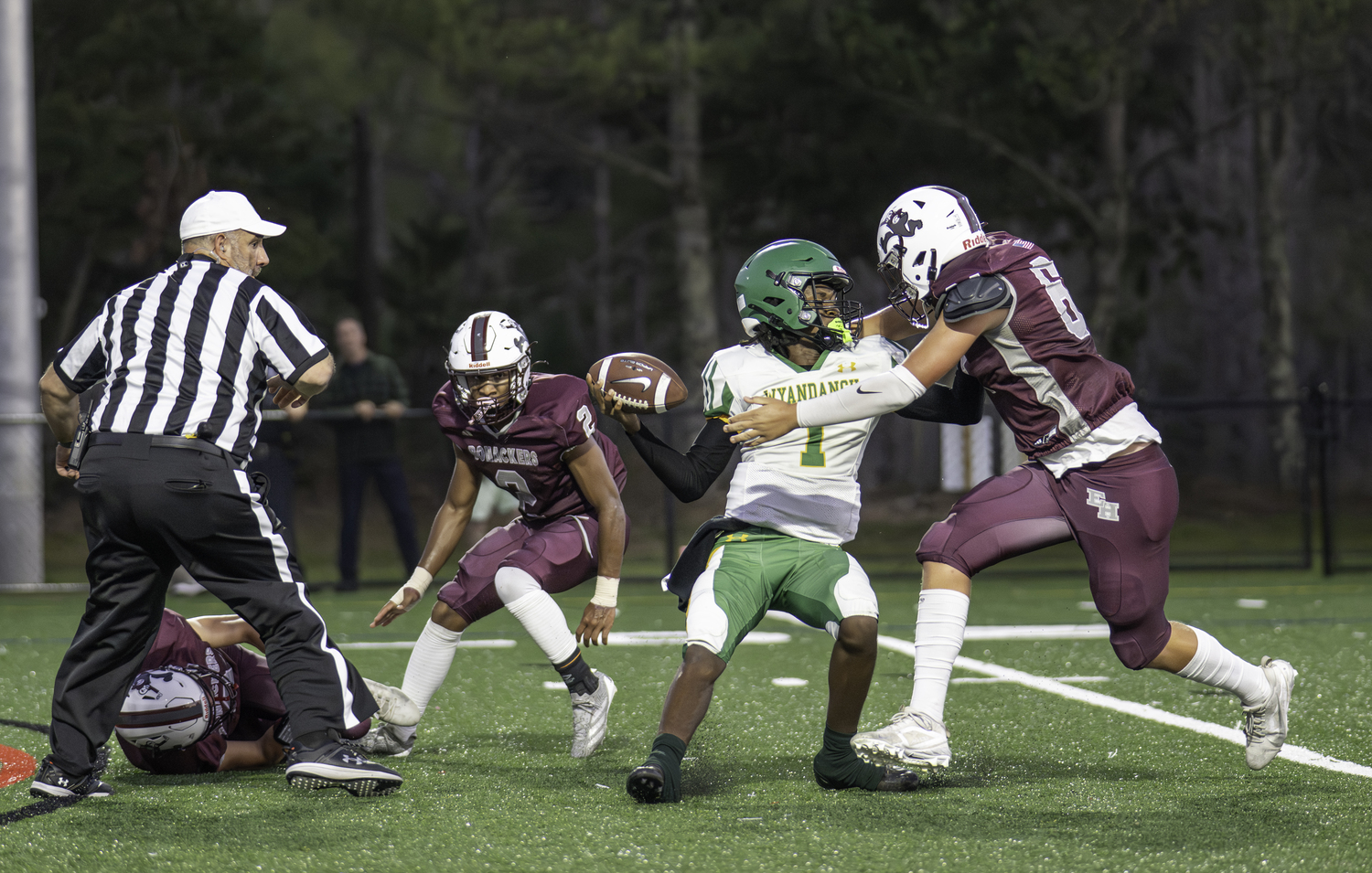 East Hampton junior defensive lineman Tiger Brew going for the sack of Wyandanch's quarterback.  MARIANNE BARNETT
