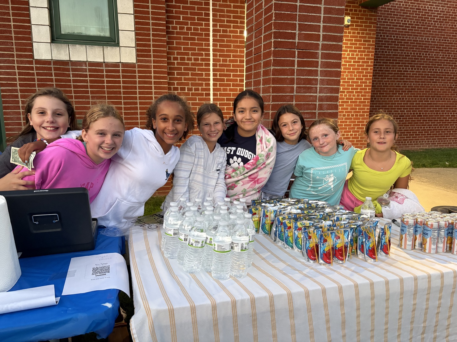 The East Quogue School PTA hosted its annual Outdoor Movie Nighy on the back lawn on Friday, September 12. The school’s sixth-graders were hard at work selling snacks and cotton candy to help fund the annual class trip to Boston. CAILIN RILEY PHOTO