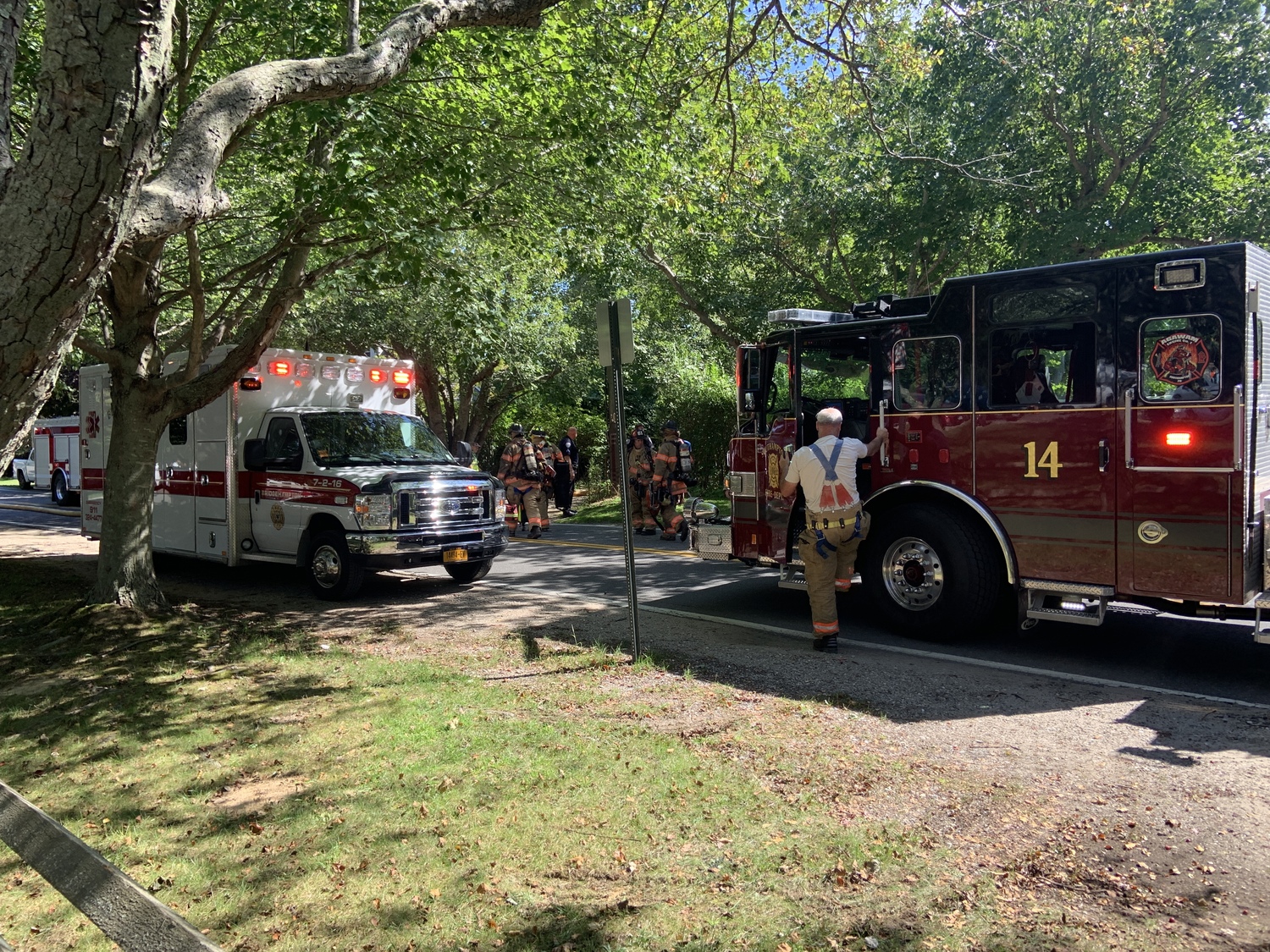 Firefighters at the scene of a house fire on Hildreth Lane in Bridgehampton on Saturday. STEPHEN J. KOTZ