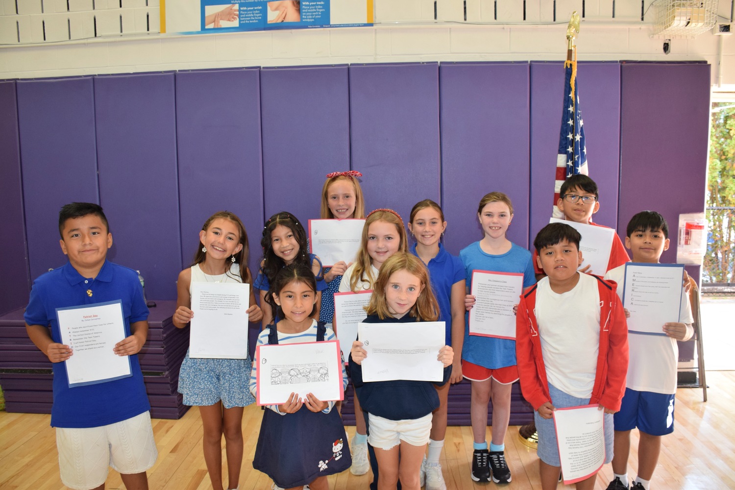 Hampton Bays Elementary School honored the anniversary of 9/11 with its annual Patriot Day memorial ceremony. As part of the ceremony, fourth graders  shared original poems and essays reflecting on what it means to be a hero and performed patriotic songs. The program also featured the presentation of a memorial wreath by the Hampton Bays Fire Department, along with remarks from local officials. This year’s event included a special celebration of the 101st birthday of Sylvia
Catena Smith, an active member of the Hampton Bays American Legion Auxiliary, Unit 924. COURTESY HAMPTON BAYS SCHOOL DISTRICT