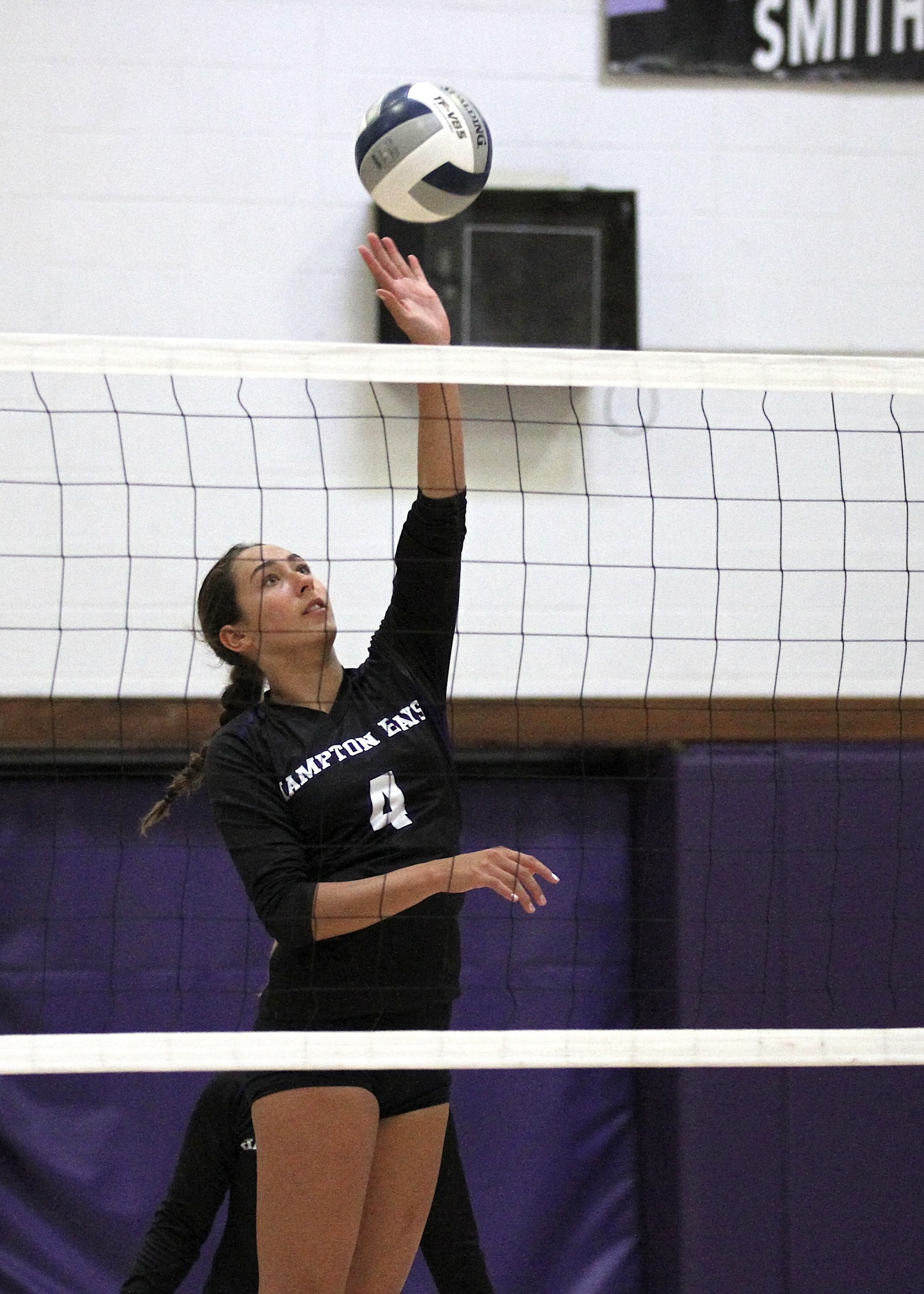 Junior middle blocker Kirra Schoerlin spikes the ball. DESIRÉE KEEGAN