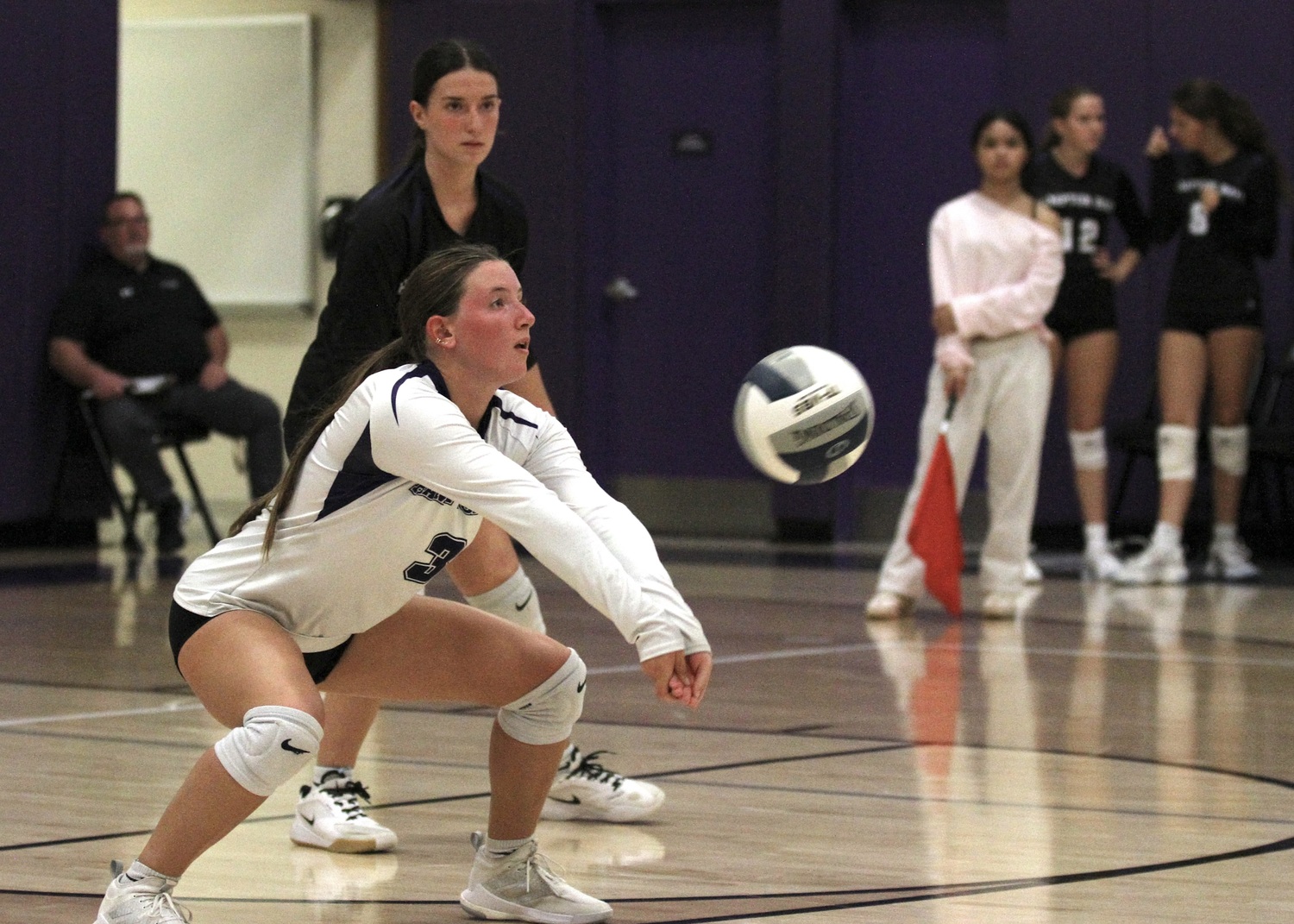 Senior libero Lilly Maffia grabs a serve receive. DESIRÉE KEEGAN