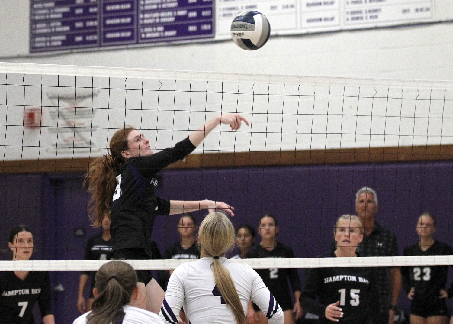 Senior middle blocker Shea Egan spikes the ball. DESIRÉE KEEGAN
