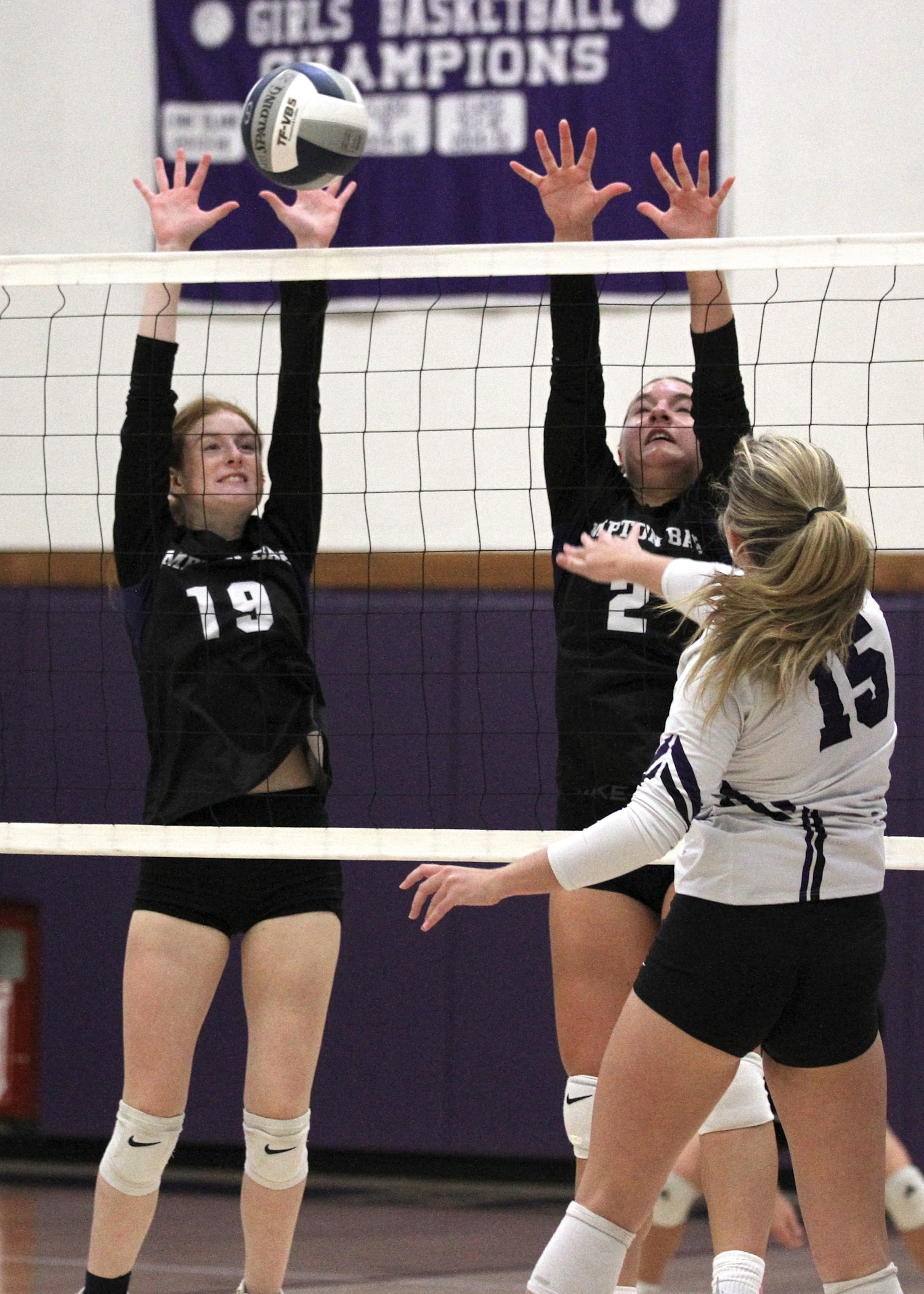 Senior middle blocker Shea Egan reaches for a block. DESIRÉE KEEGAN