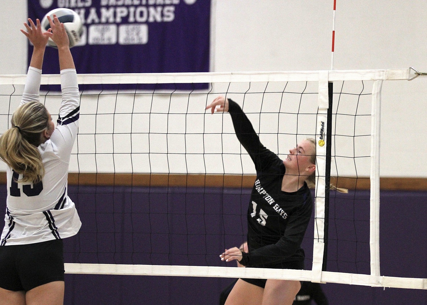 Senior outside hitter Taylor Meyers crosses the court with a kill to win the third set. DESIRÉE KEEGAN