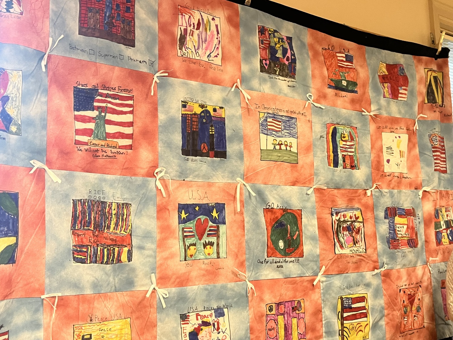 Quilts with squares handmade by Quogue School students in the aftermath of the September 11 attacks in 2001 are currently on display at the Quogue Firehouse. COURTESY QUOGUE VILLAGE FD