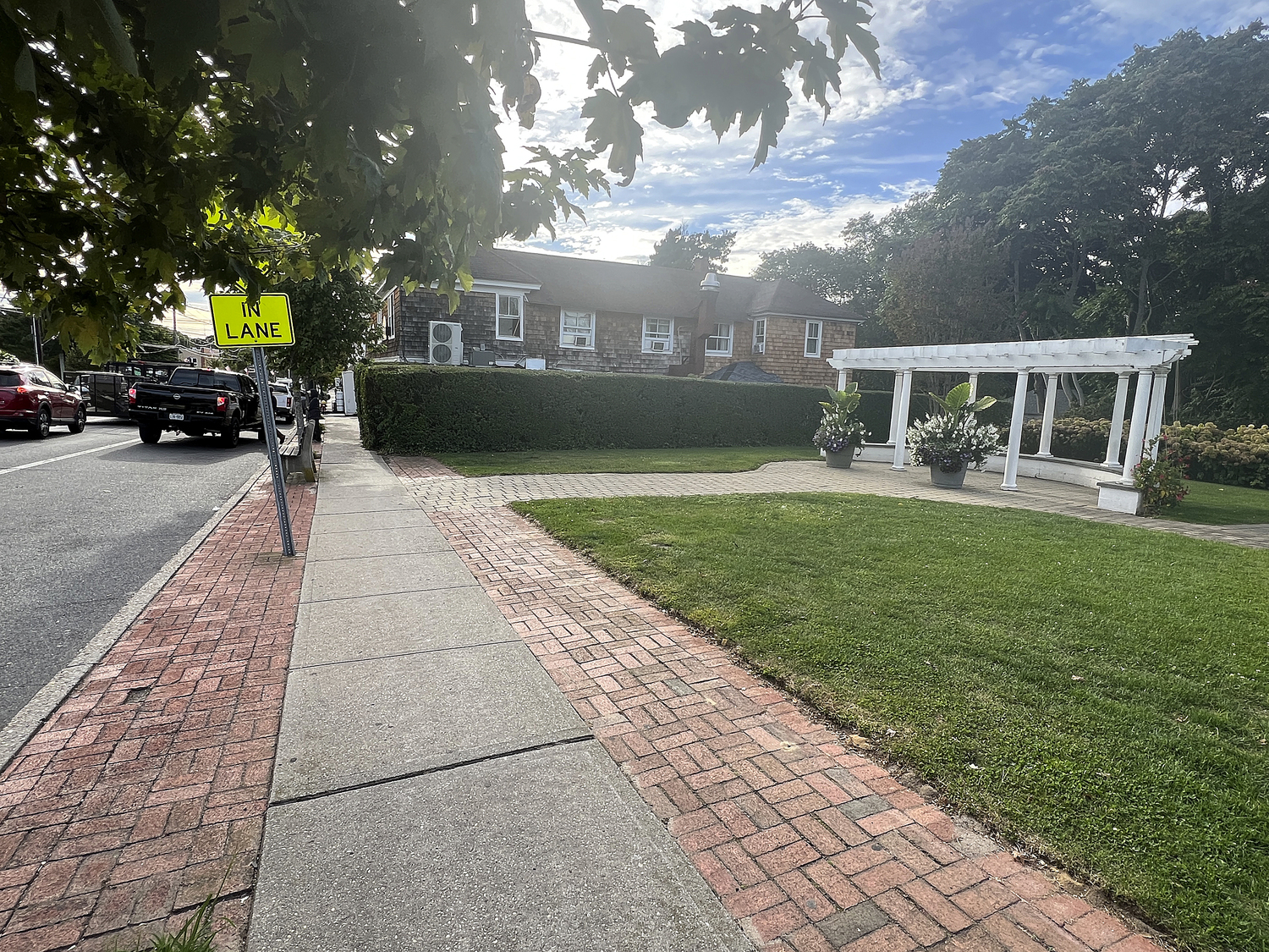 Trash cans are conspicuously missing from Main Street in Hampton Bays.  DANA SHAW