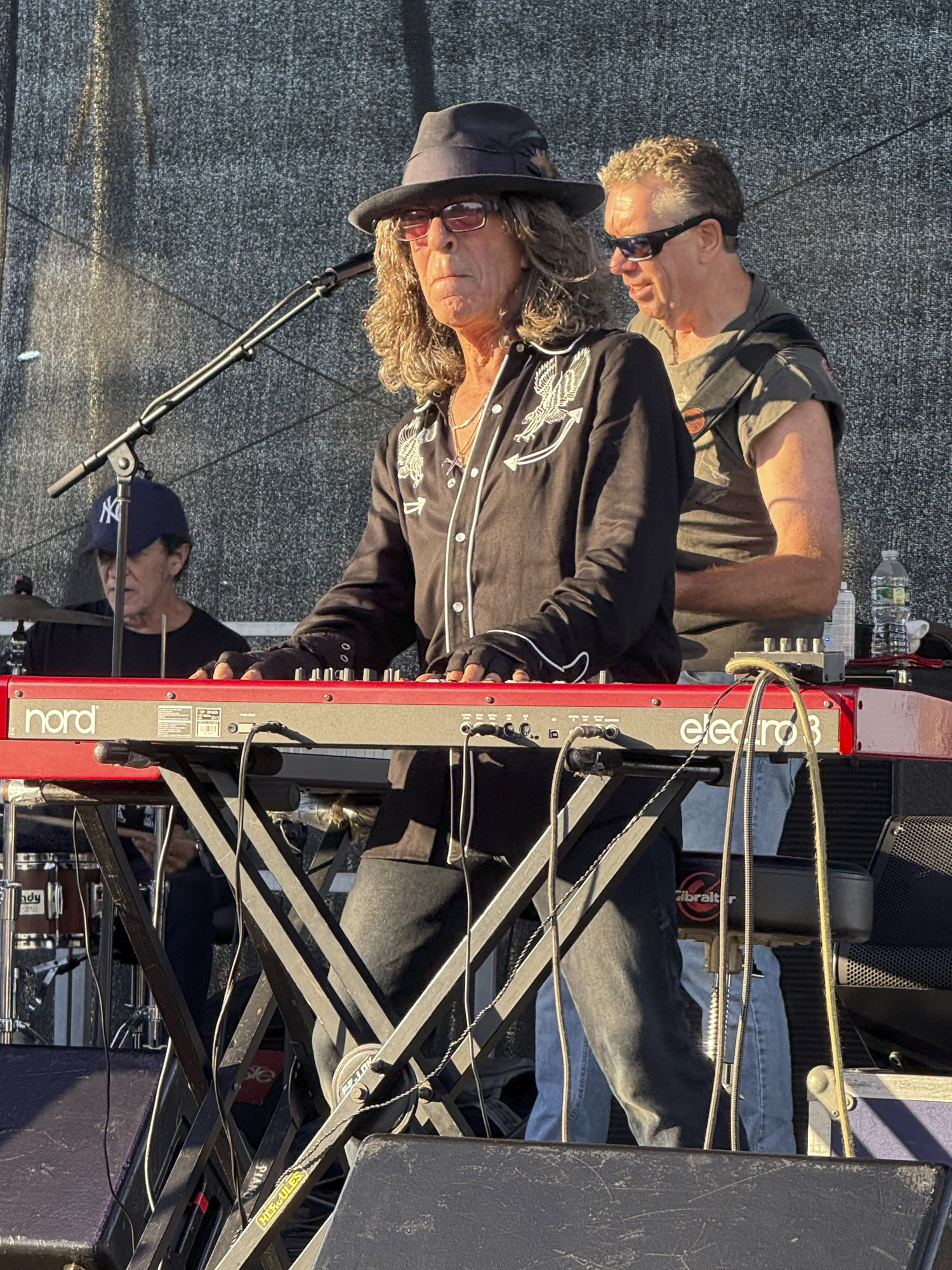 Joe Delia onstage with Nancy Atlas on Sunday afternoon in Marine Park.  GAVIN MENU