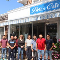 Beth's Cafe in Quogue, owned and operated for 15 years by Beth D'Alessio--at her store with her long-time staff members earlier this month--will close for good on September 21. CAILIN RILEY