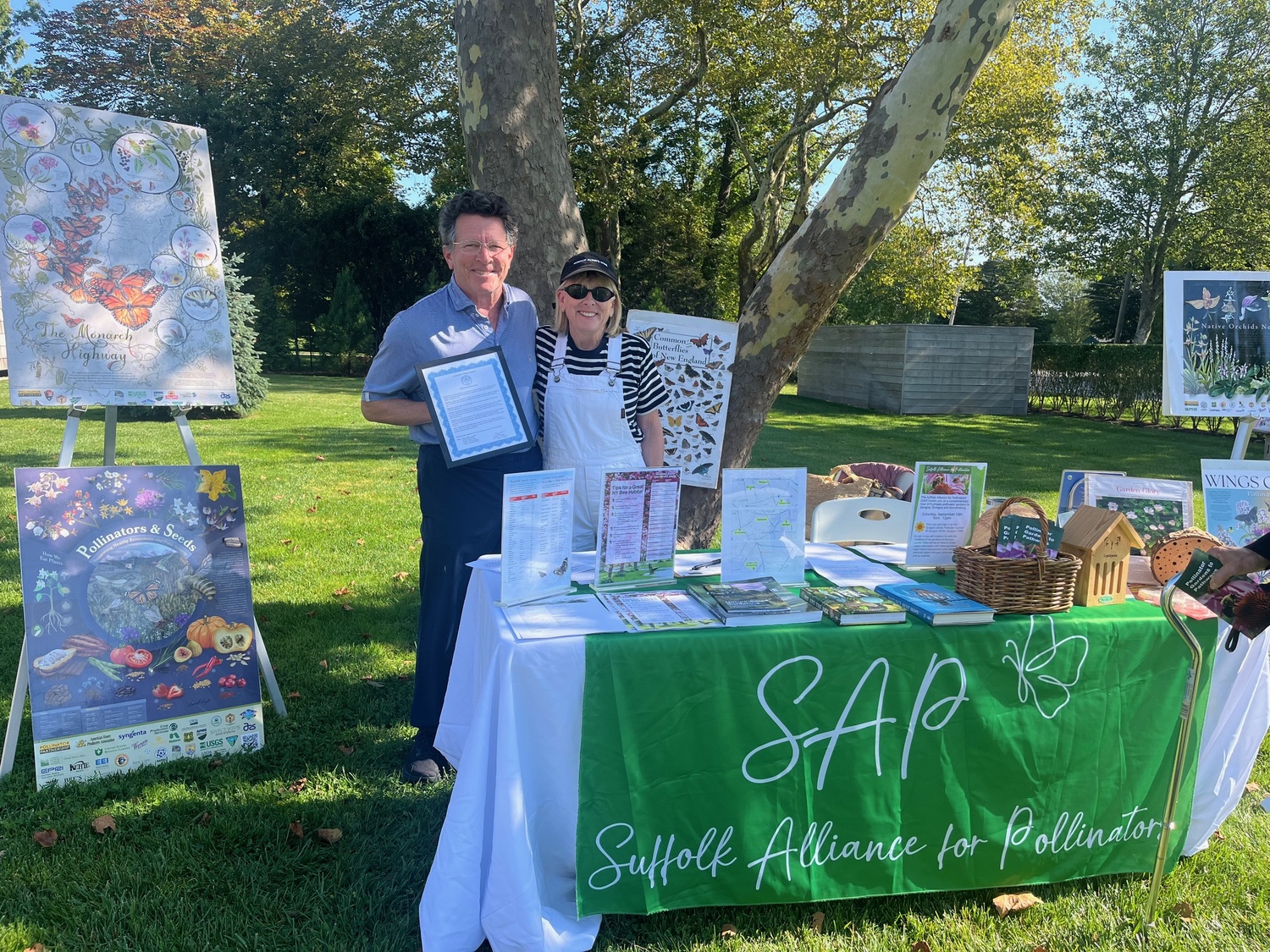 Quogue Mayor Robert Treuhold and Westhampton Garden Club's Peggy Vezeris at the sign-in table at the Quogue Library.  COURTESY WESTHAMPTON GARDEN CLUB