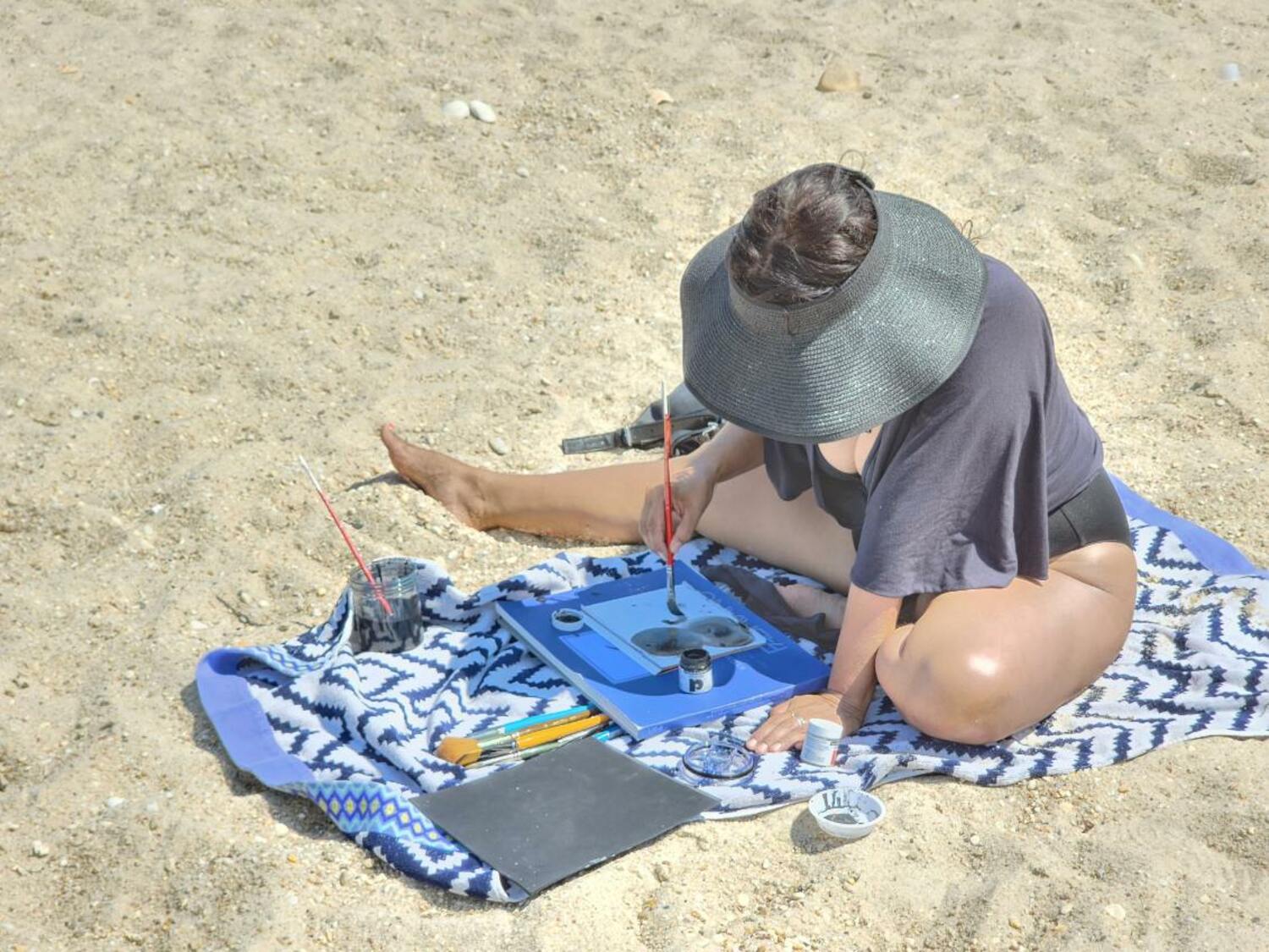 Nanibah Chacon draws by the water. JEREMY DENNIS