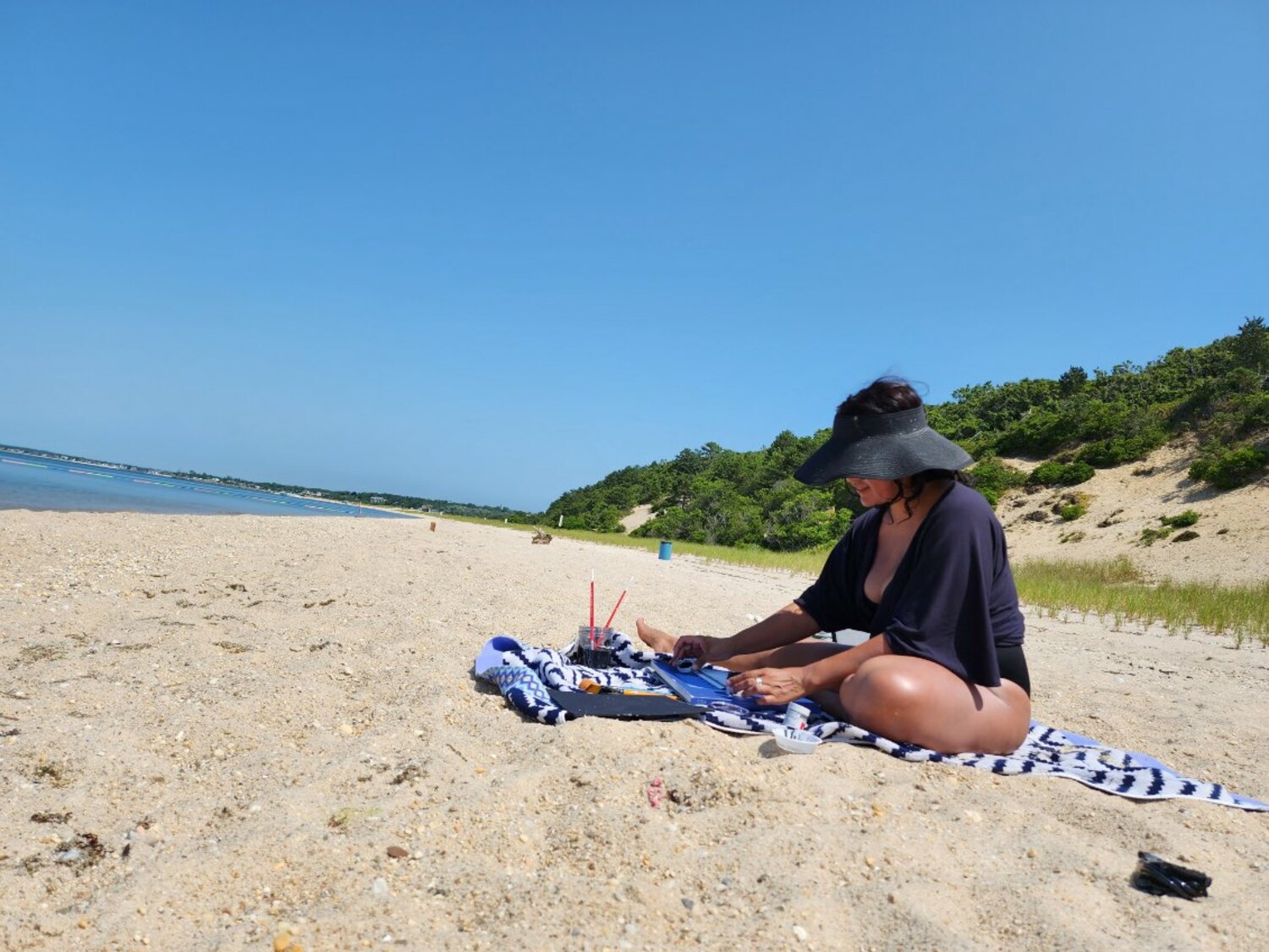 Nanibah Chacon draws by the water. JEREMY DENNIS